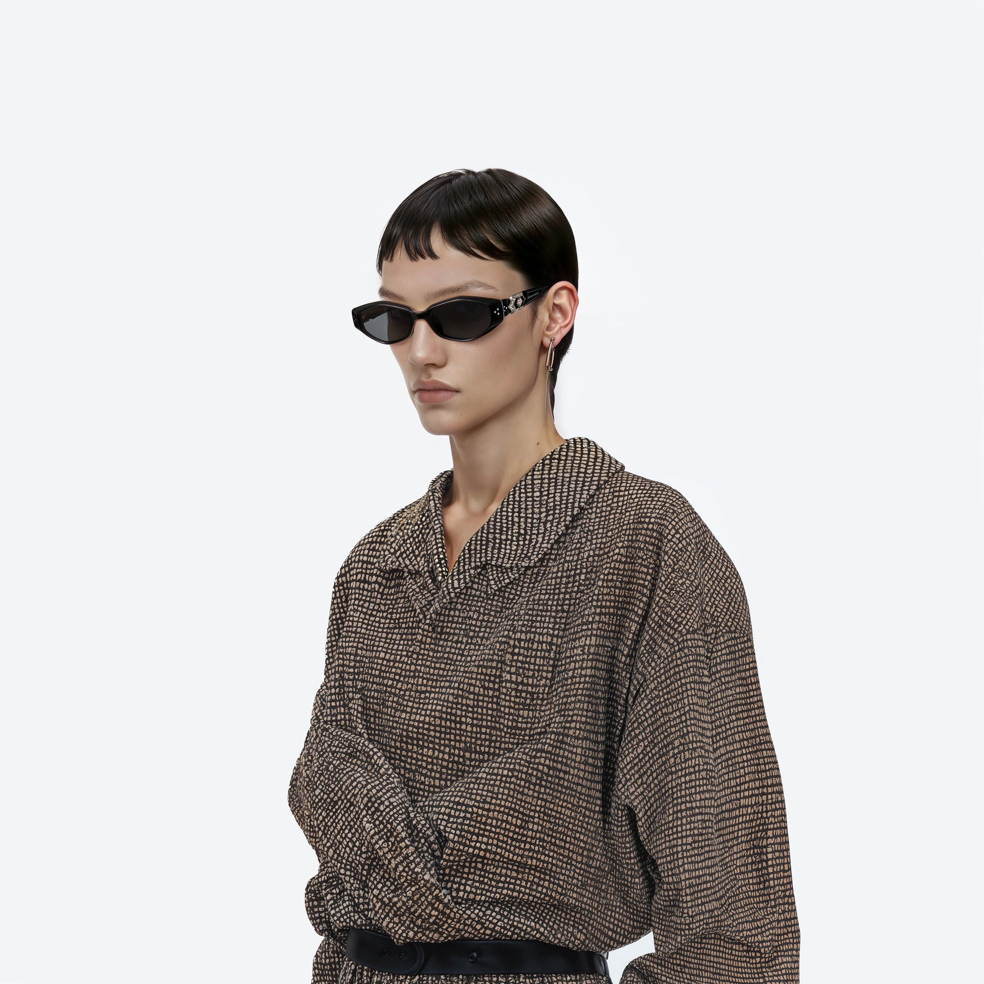 Model wearing the Vegax 01 Black Acetate framed Oval sunglasses.