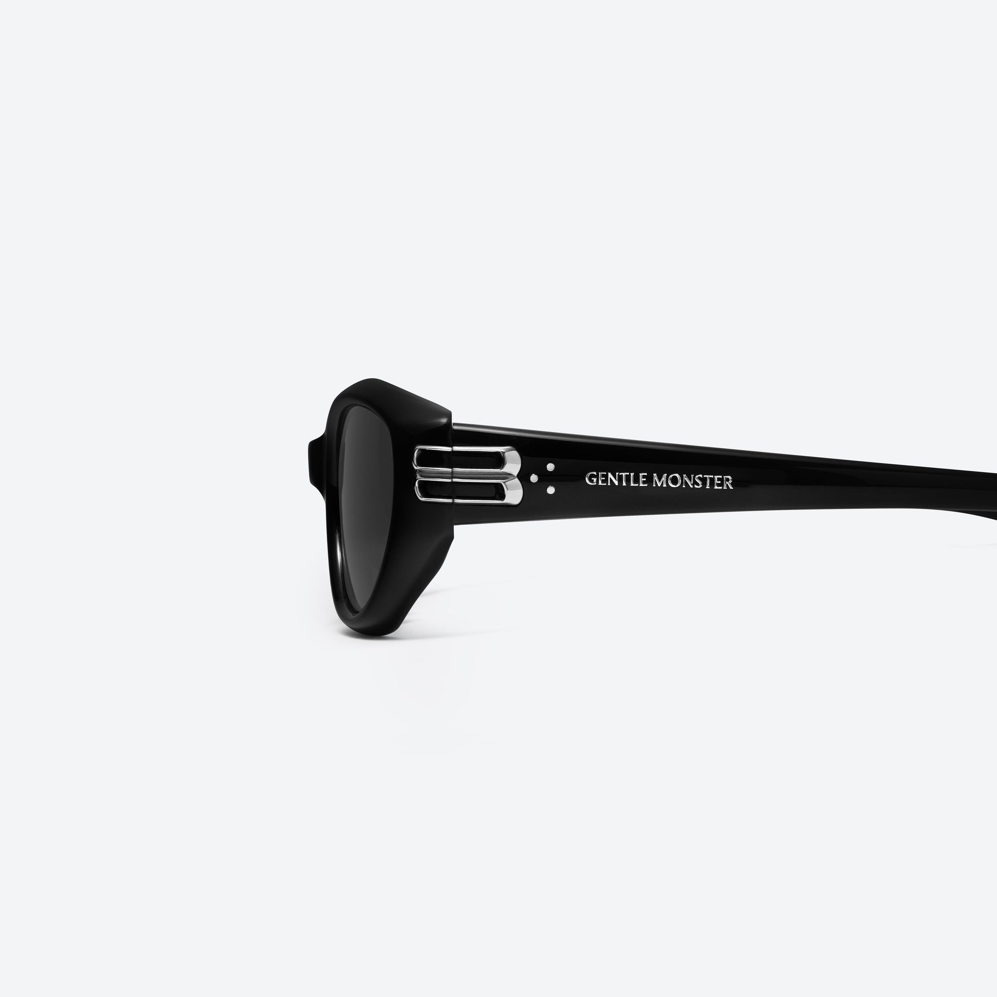 A detailed left view of Gentle Monster Sosomo 01 Black Acetate framed Oval sunglasses.