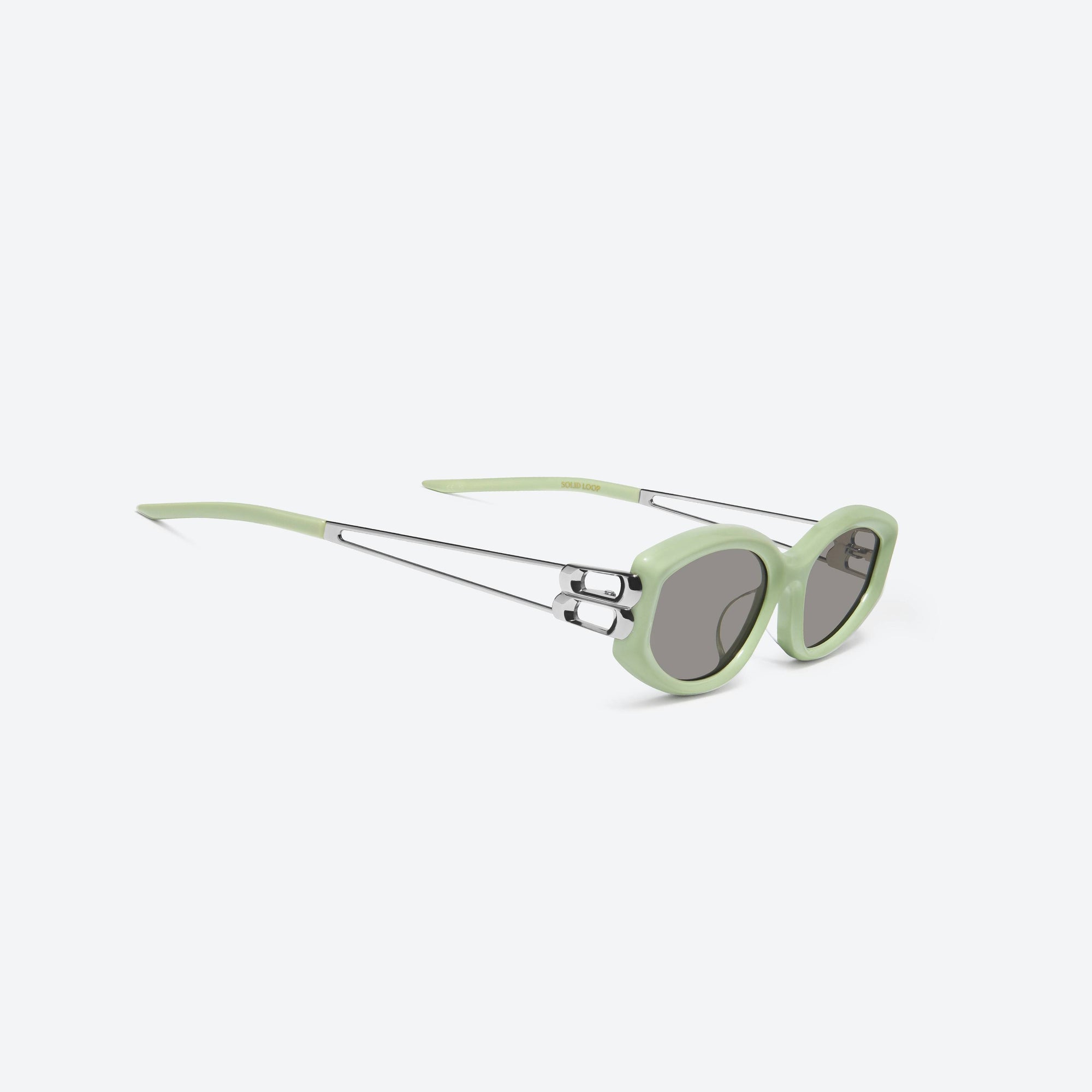45-degree detailed view of Gentle Monster Solid Loop GR8 Green Mixed framed Square sunglasses.