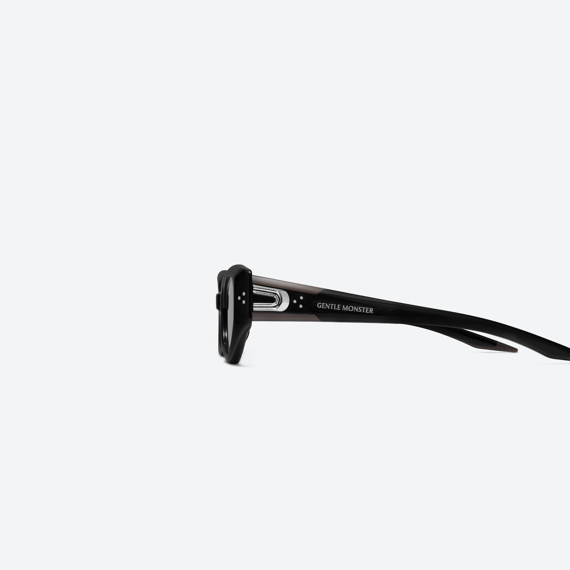 A detailed left view of Gentle Monster Devon 01 Black Acetate framed Cat-eye sunglasses.