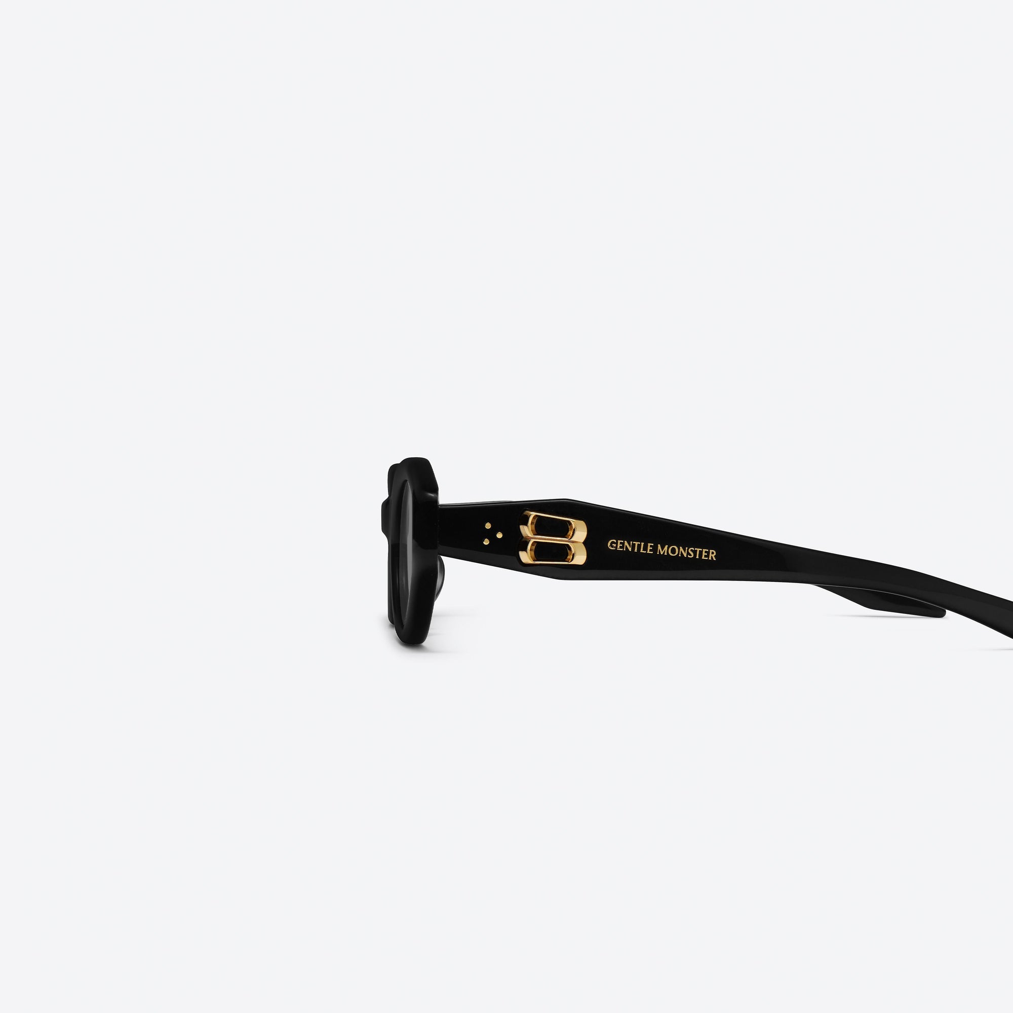 A detailed left view of Gentle Monster Vamp 01 Black Acetate framed Oval sunglasses.