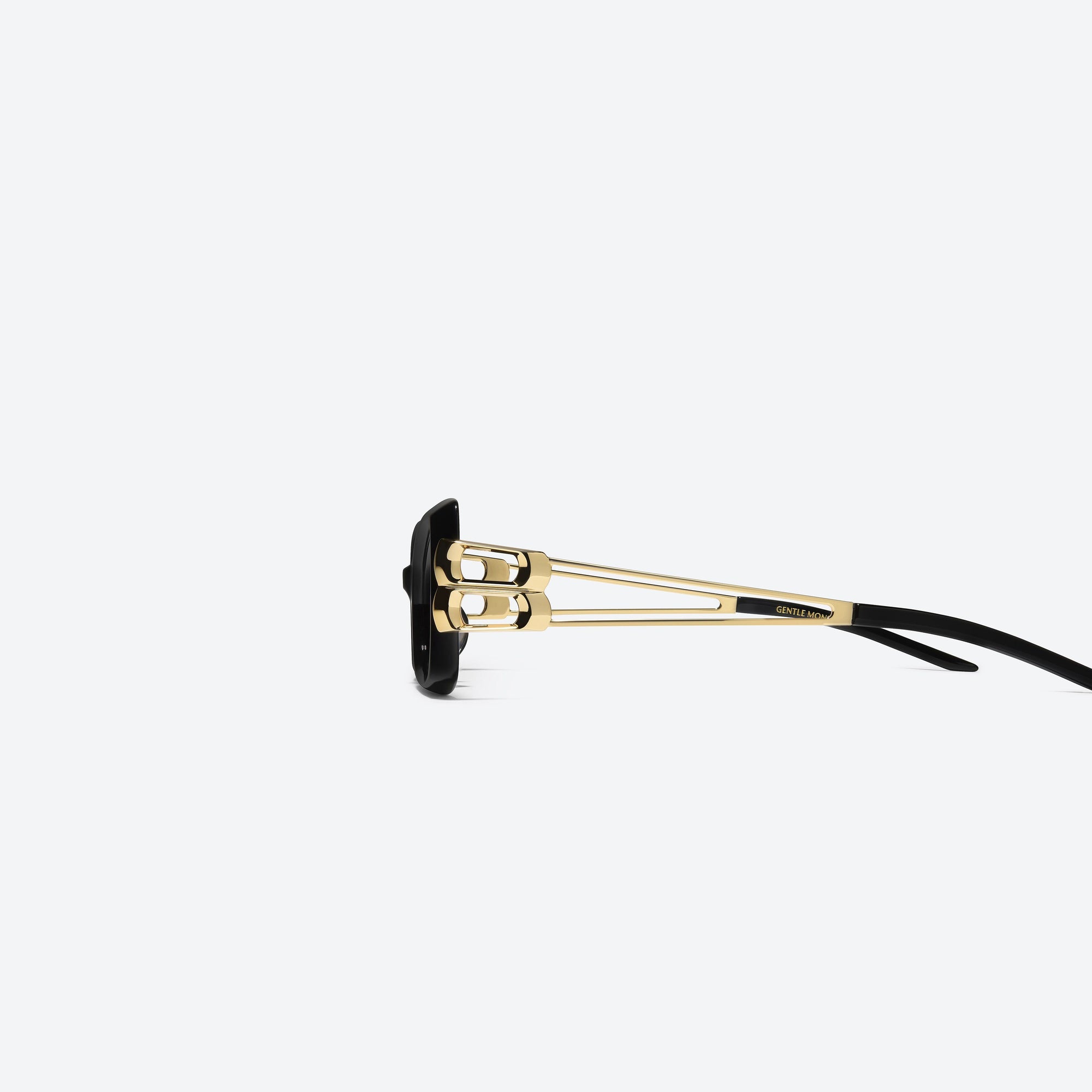 A detailed left view of Gentle Monster Nemesis 01 Black Mixed framed Cat-eye sunglasses.