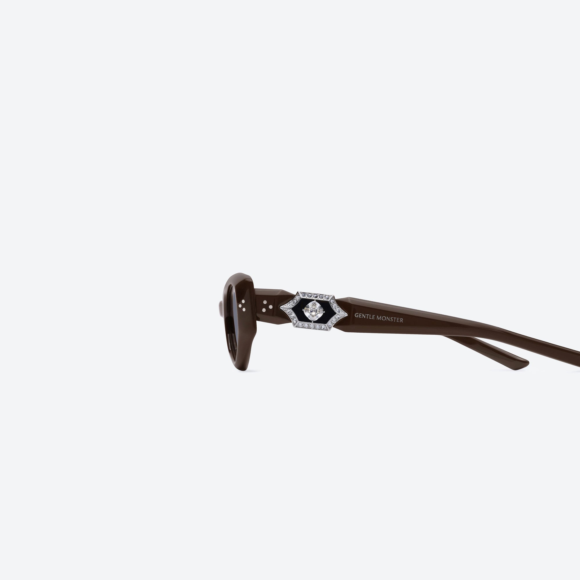 A detailed left view of Gentle Monster Ruvy Van BR3 Brown Acetate framed Cat-eye sunglasses.