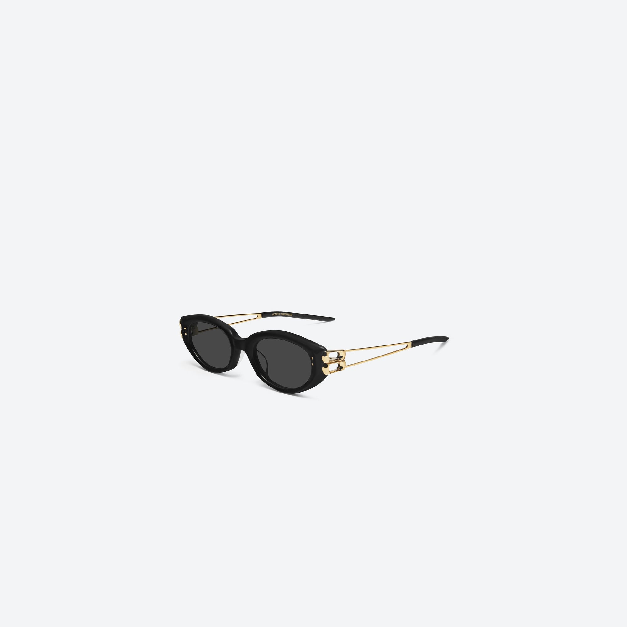 45-degree view of Gentle Monster Kunst 01GD Similar Black Mixed framed Cat-eye sunglasses.