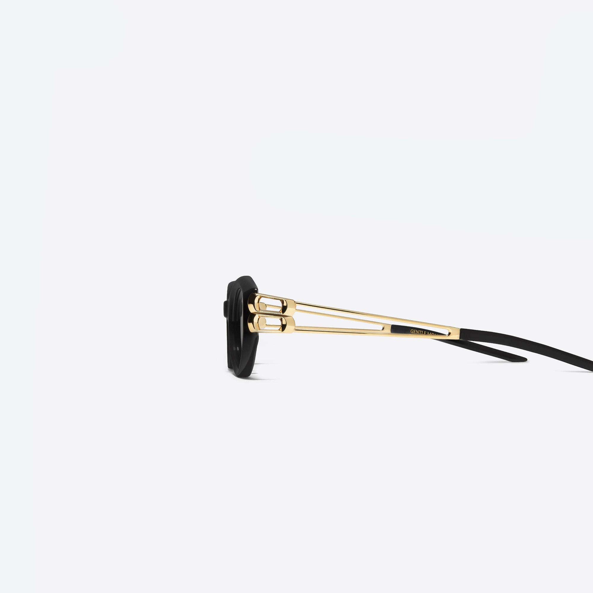 A detailed left view of Gentle Monster Kunst 01GD Similar Black Mixed framed Cat-eye sunglasses.