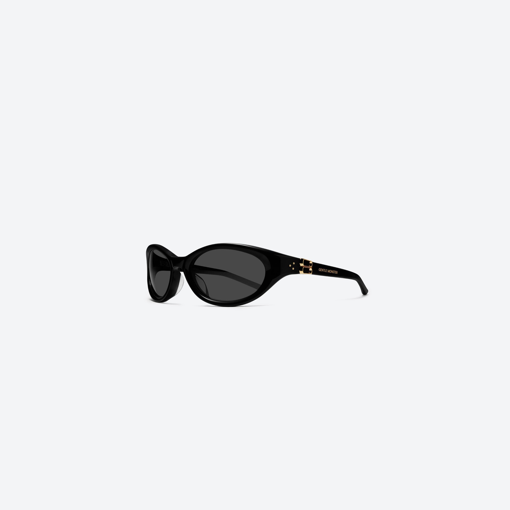 45-degree view of Gentle Monster Ion 01 Black Acetate framed Wraparound sunglasses.
