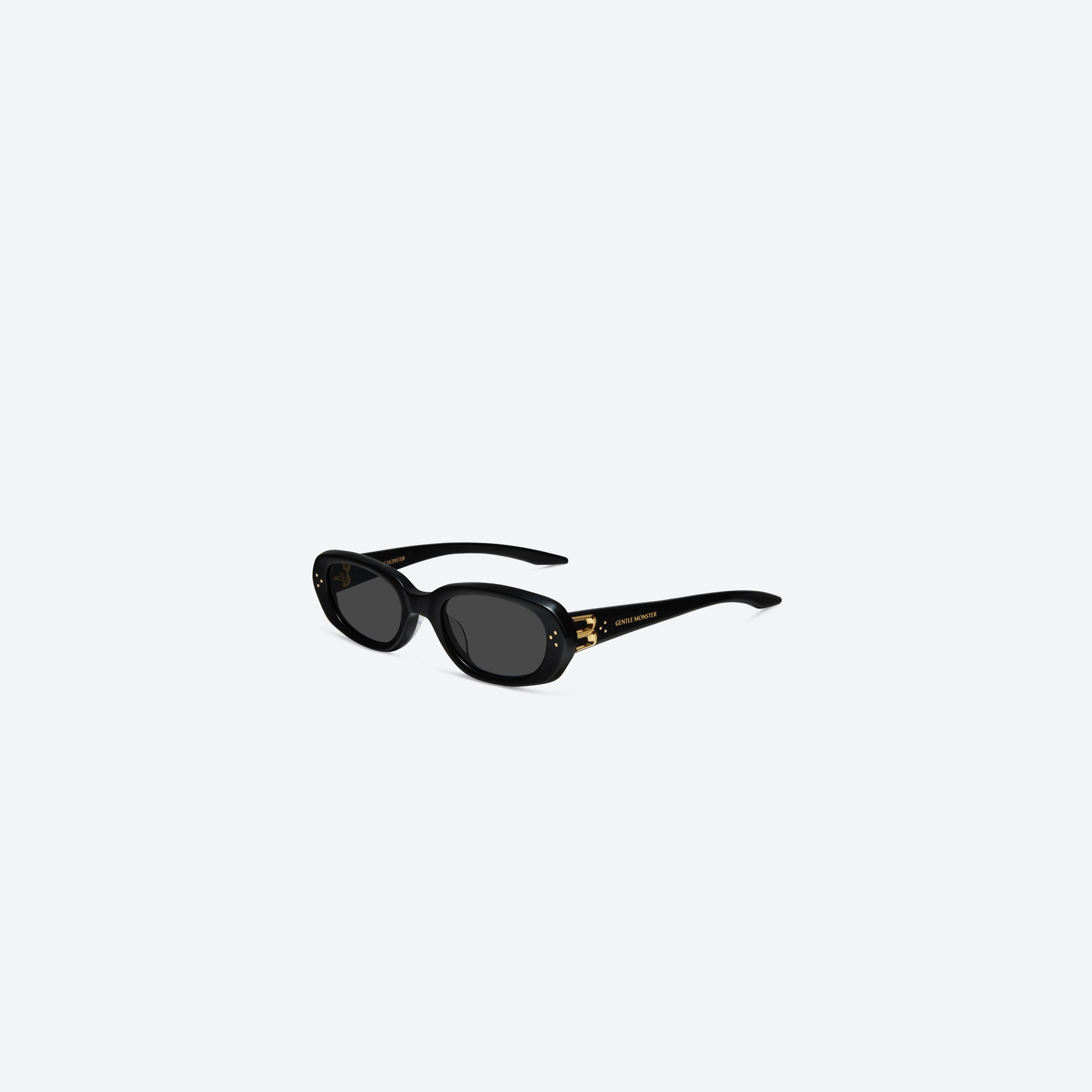 45-degree view of Gentle Monster Ninishe 01 Black Acetate framed Oval sunglasses.