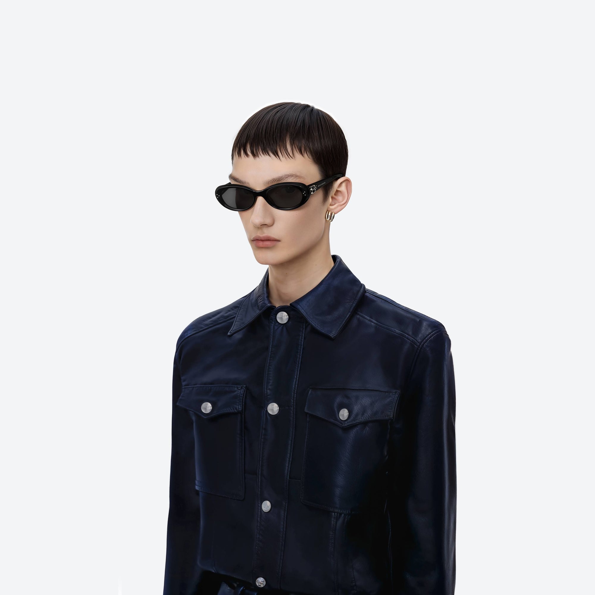 Model wearing the Cocoa 01 Black Acetate framed Oval sunglasses.