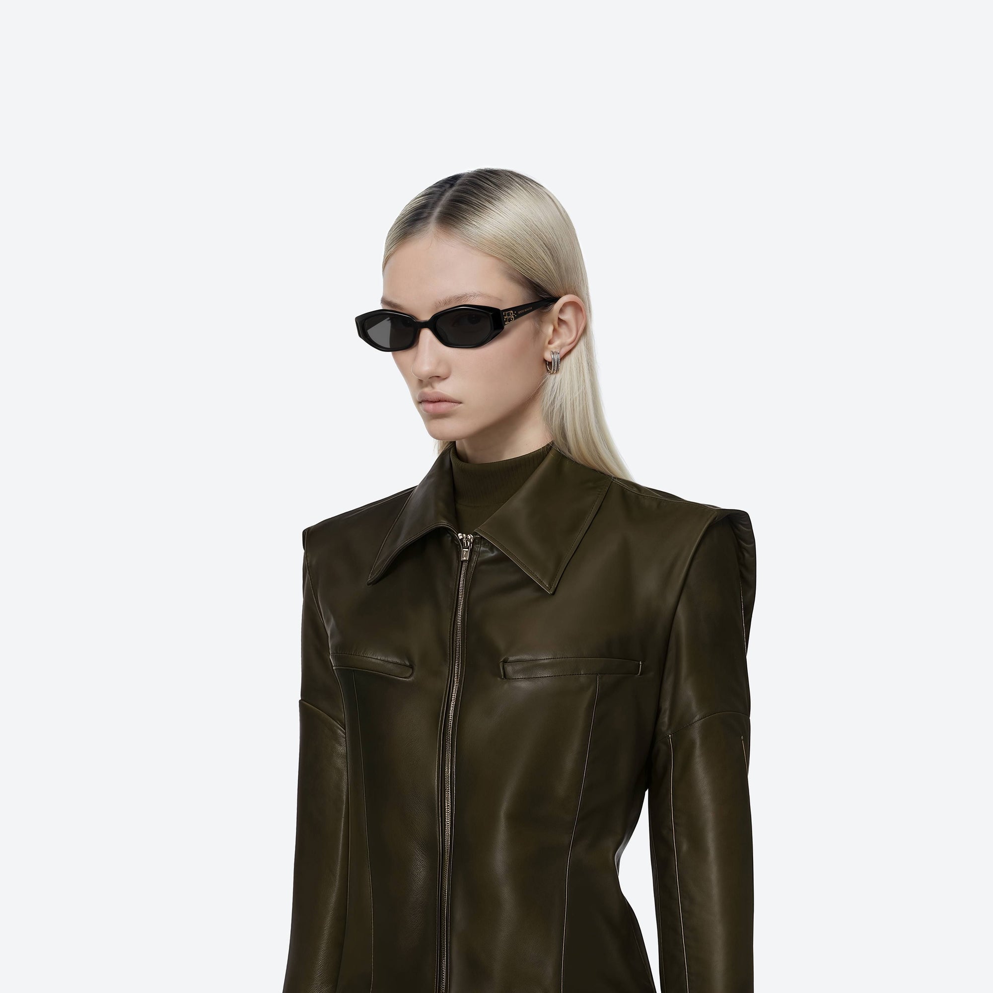 Model wearing the Miro 01 Black Acetate framed Oval sunglasses.