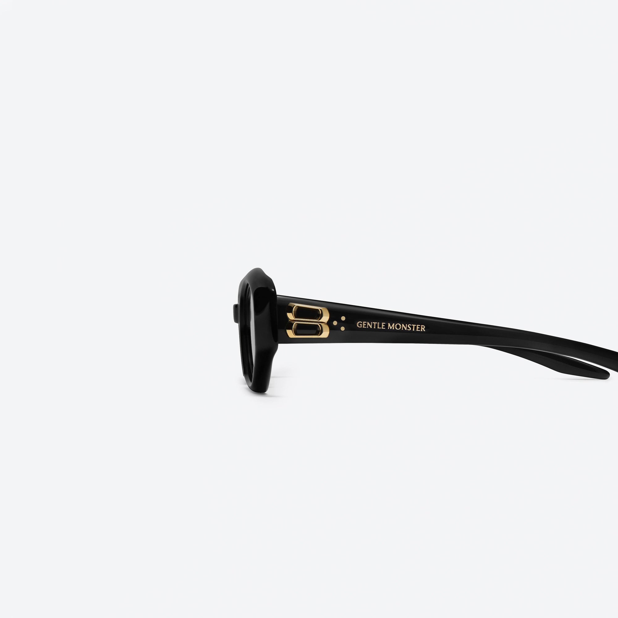 A detailed left view of Gentle Monster Miro 01 Black Acetate framed Oval sunglasses.