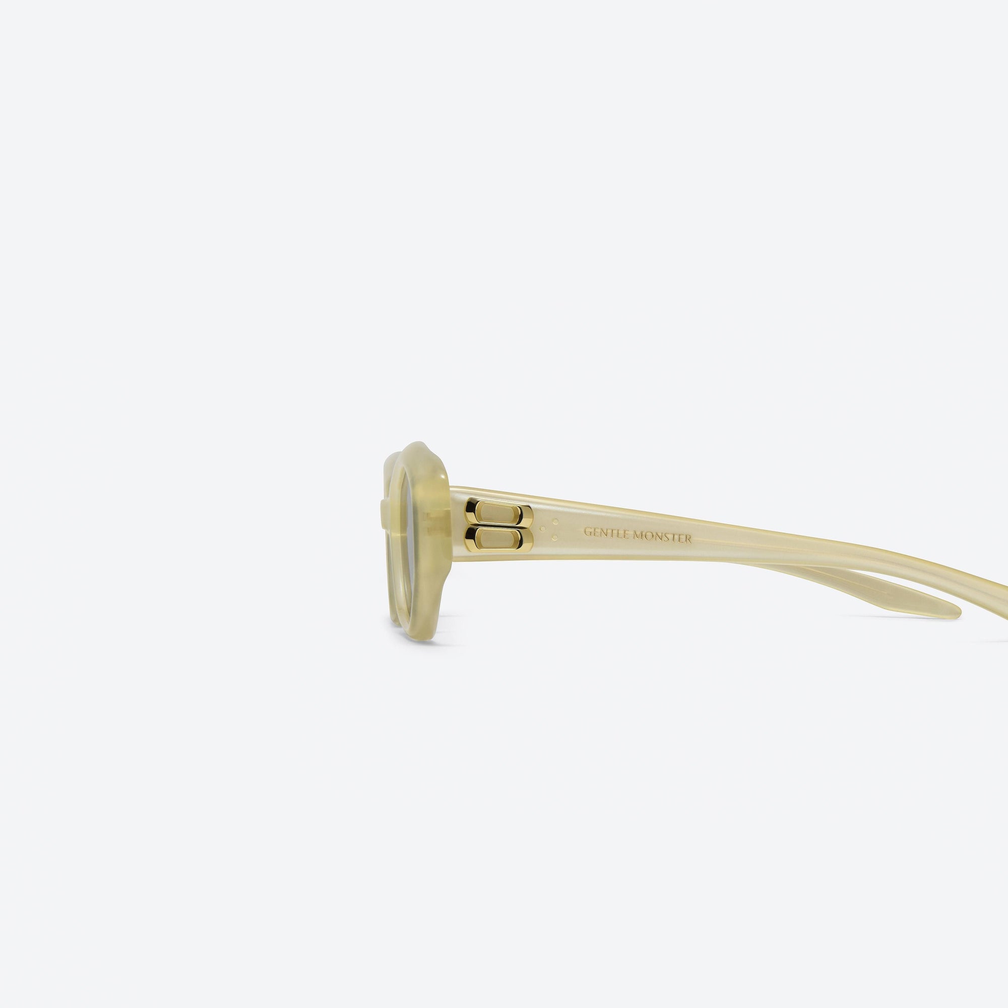 A detailed left view of Gentle Monster Miro YC10 Yellow Acetate framed Oval sunglasses.