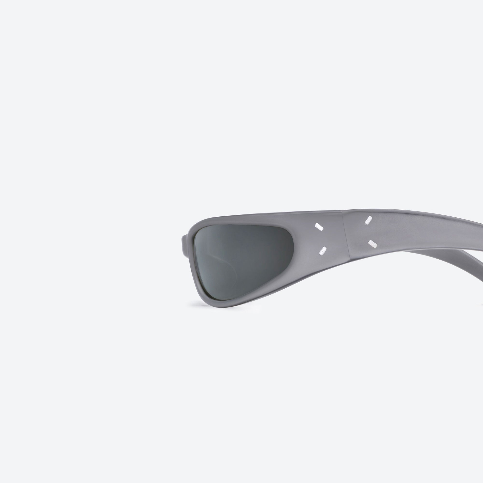 A detailed left view of Gentle Monster Maison Margiela - MM203 G14(SM) Silver Acetate framed Wraparound sunglasses.