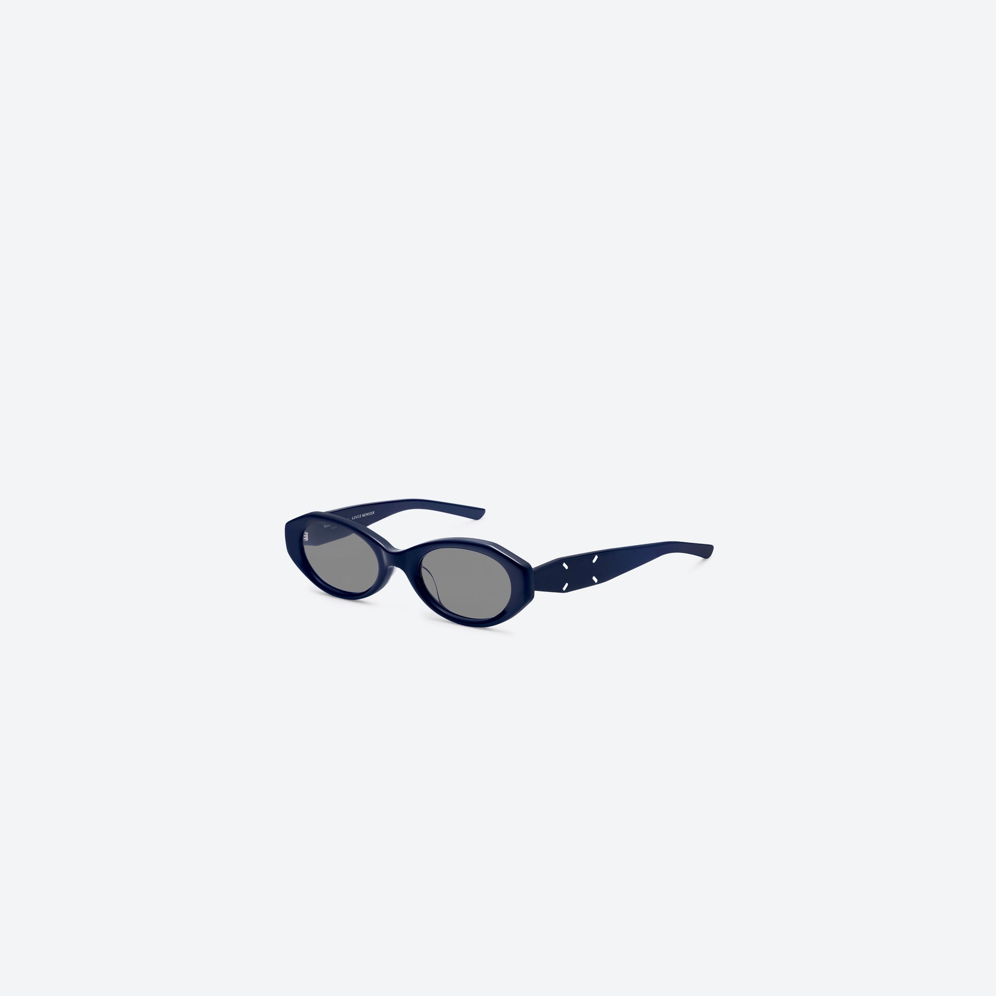 45-degree view of Gentle Monster Maison Margiela - MM204 N6(G) Blue Acetate framed Oval sunglasses.