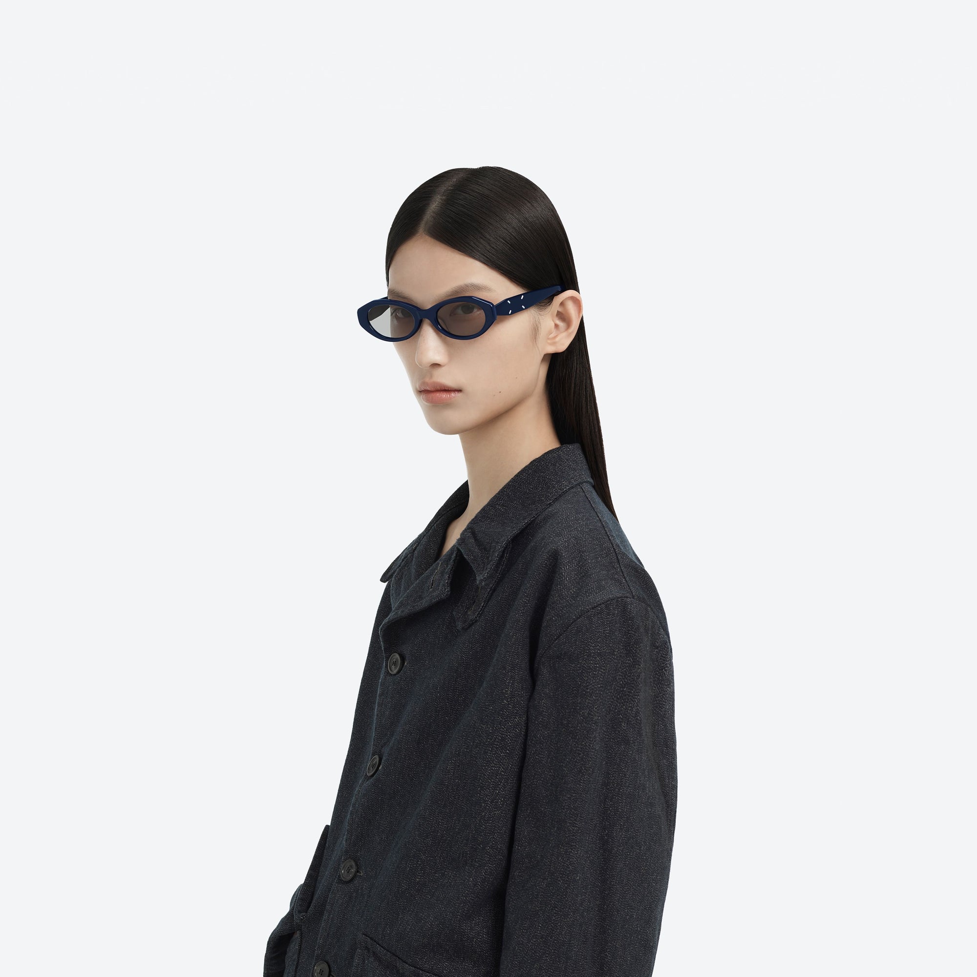 Model wearing the Maison Margiela - MM204 N6(G) Blue Acetate framed Oval sunglasses.