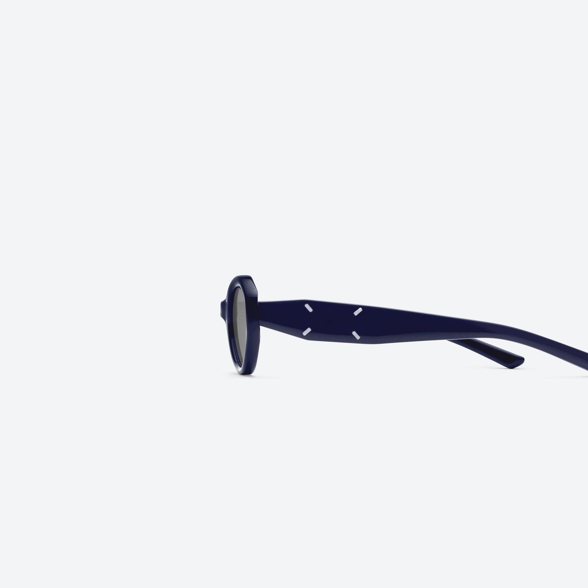 A detailed left view of Gentle Monster Maison Margiela - MM204 N6(G) Blue Acetate framed Oval sunglasses.