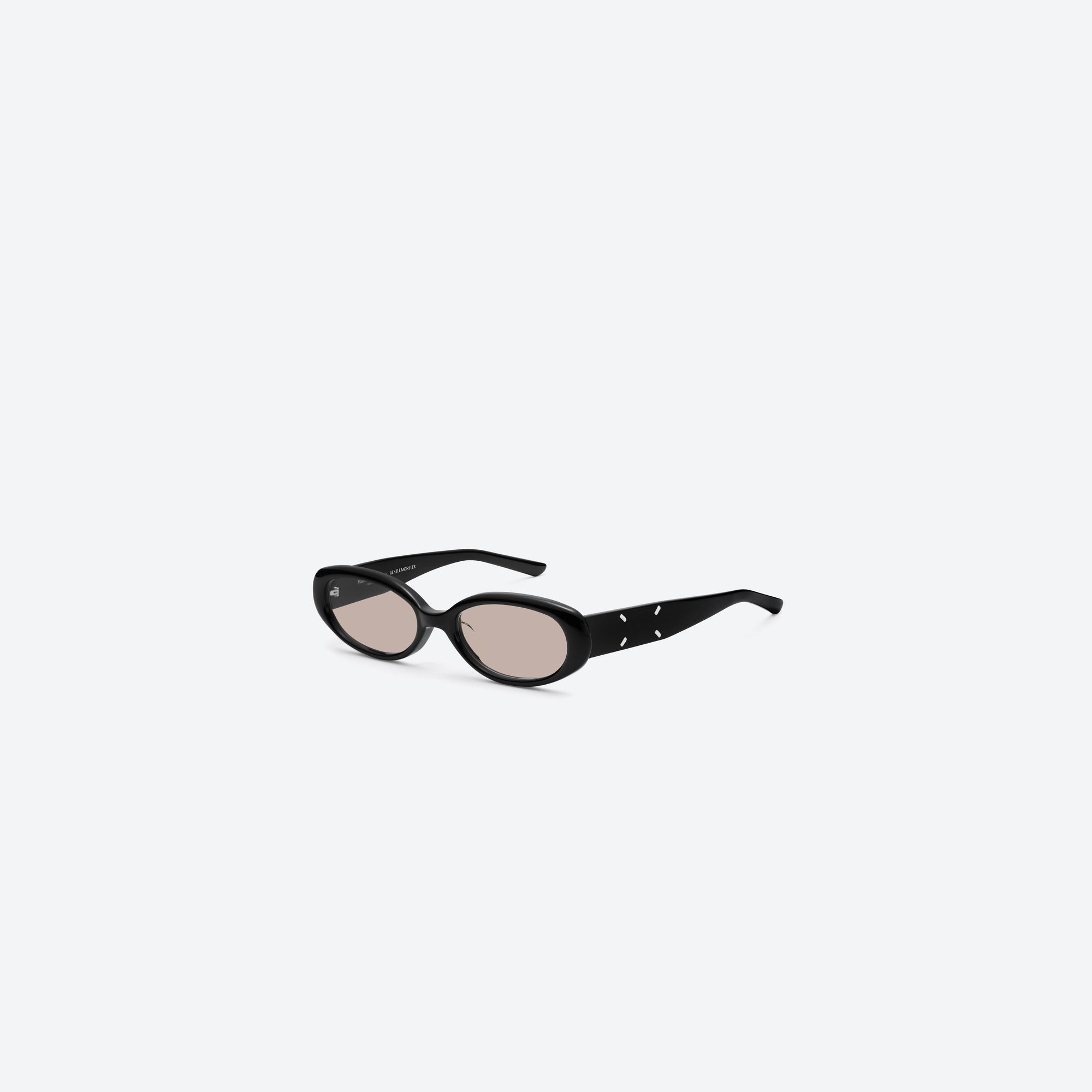 45-degree view of Gentle Monster Maison Margiela - MM206 01(BR) Black Acetate framed Oval sunglasses.