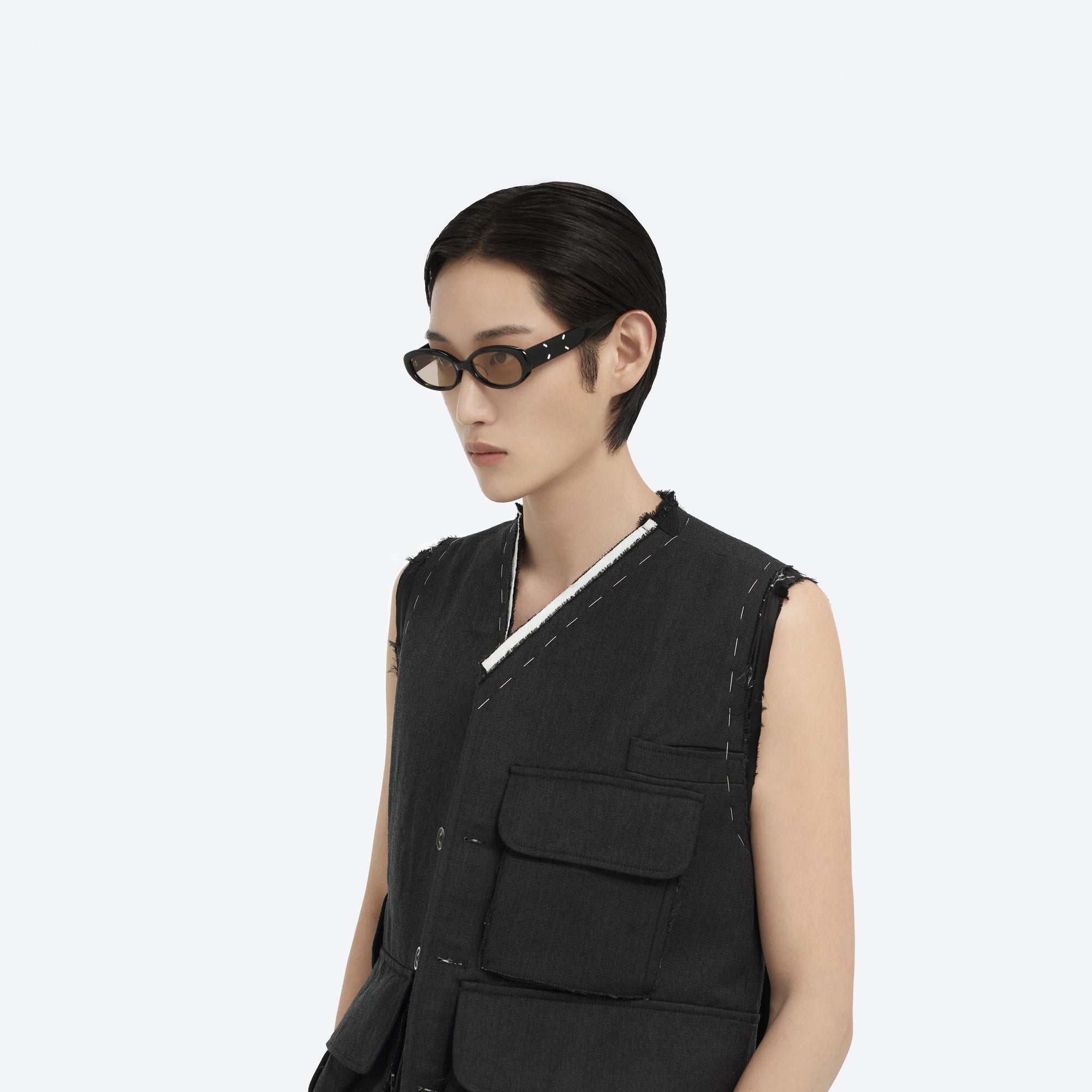 Model wearing the Maison Margiela - MM206 01(BR) Black Acetate framed Oval sunglasses.