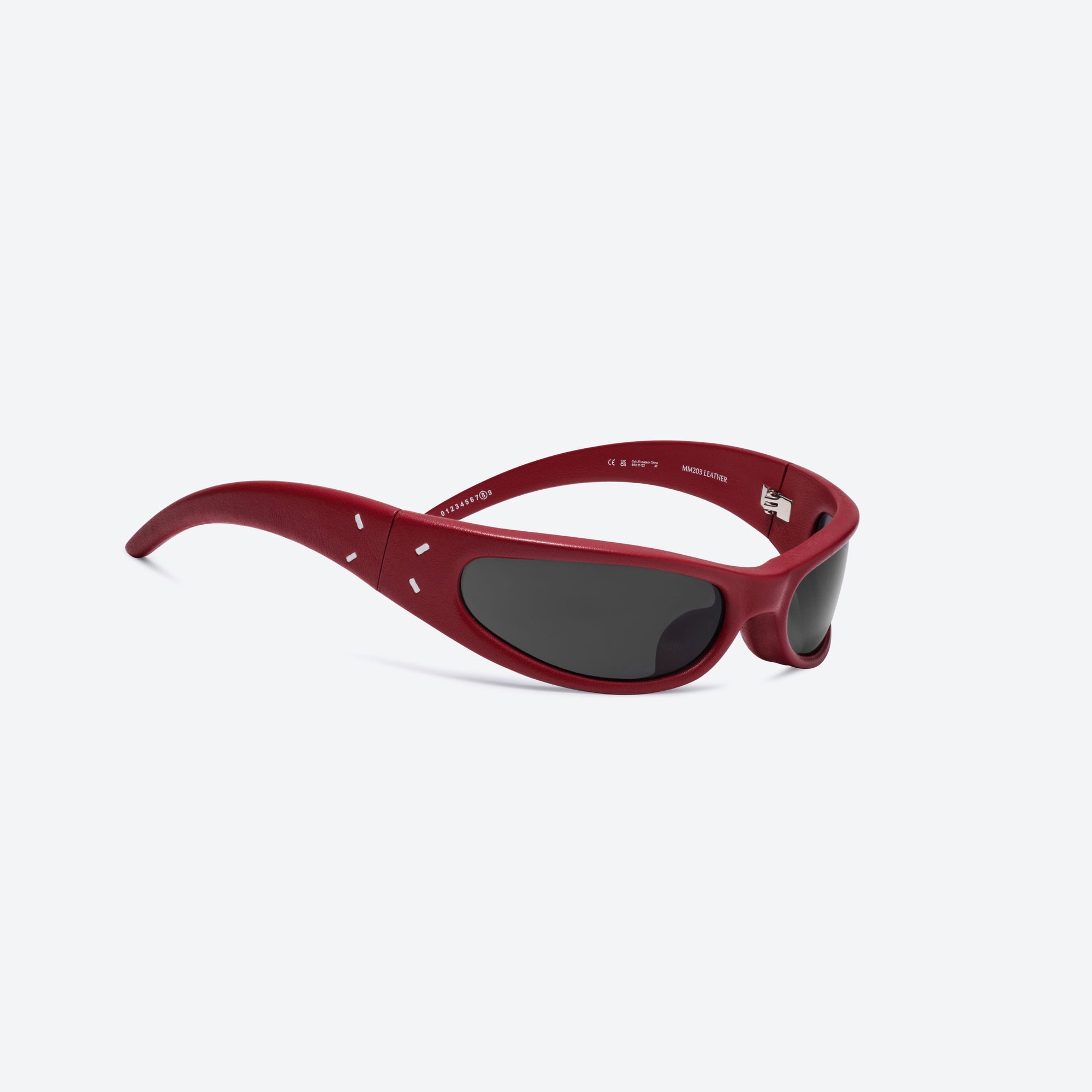 45-degree detailed view of Gentle Monster Maison Margiela - MM203 Leather LR1 Red Acetate framed Oval sunglasses.