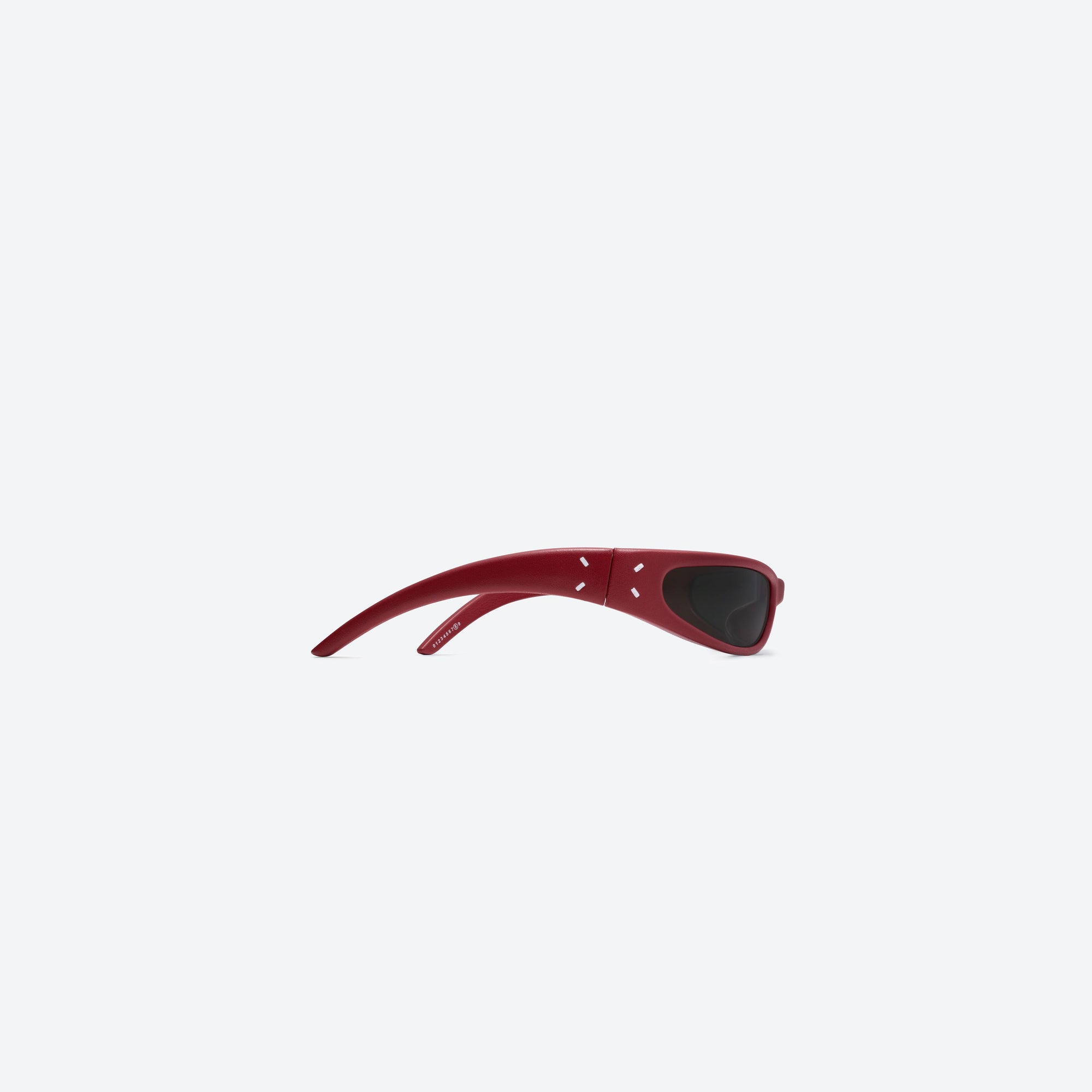A detailed right view of Gentle Monster Maison Margiela - MM203 Leather LR1 Red Acetate framed Oval sunglasses.
