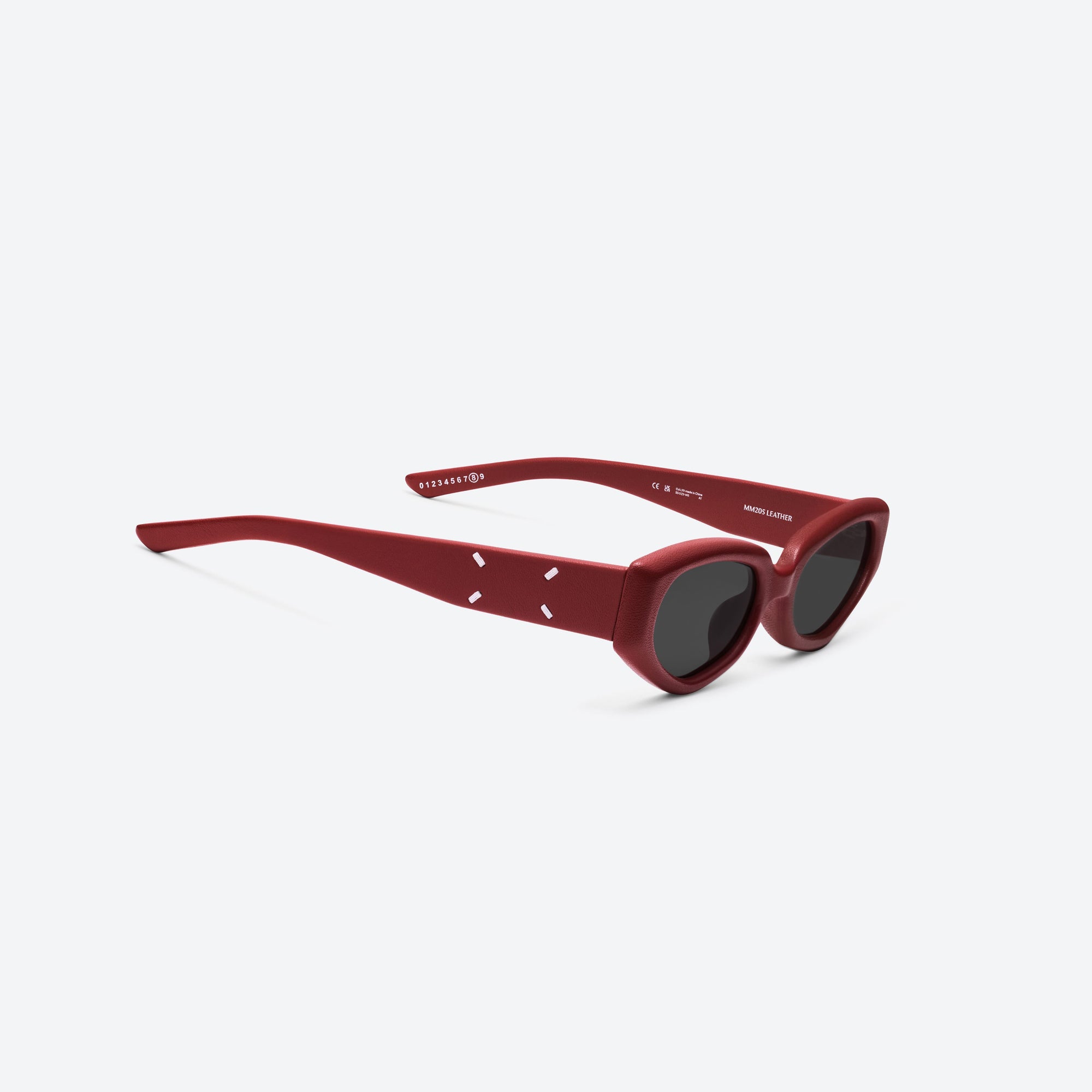 45-degree detailed view of Gentle Monster Maison Margiela - MM205 Leather LR1 Red Acetate framed Cat-eye sunglasses.