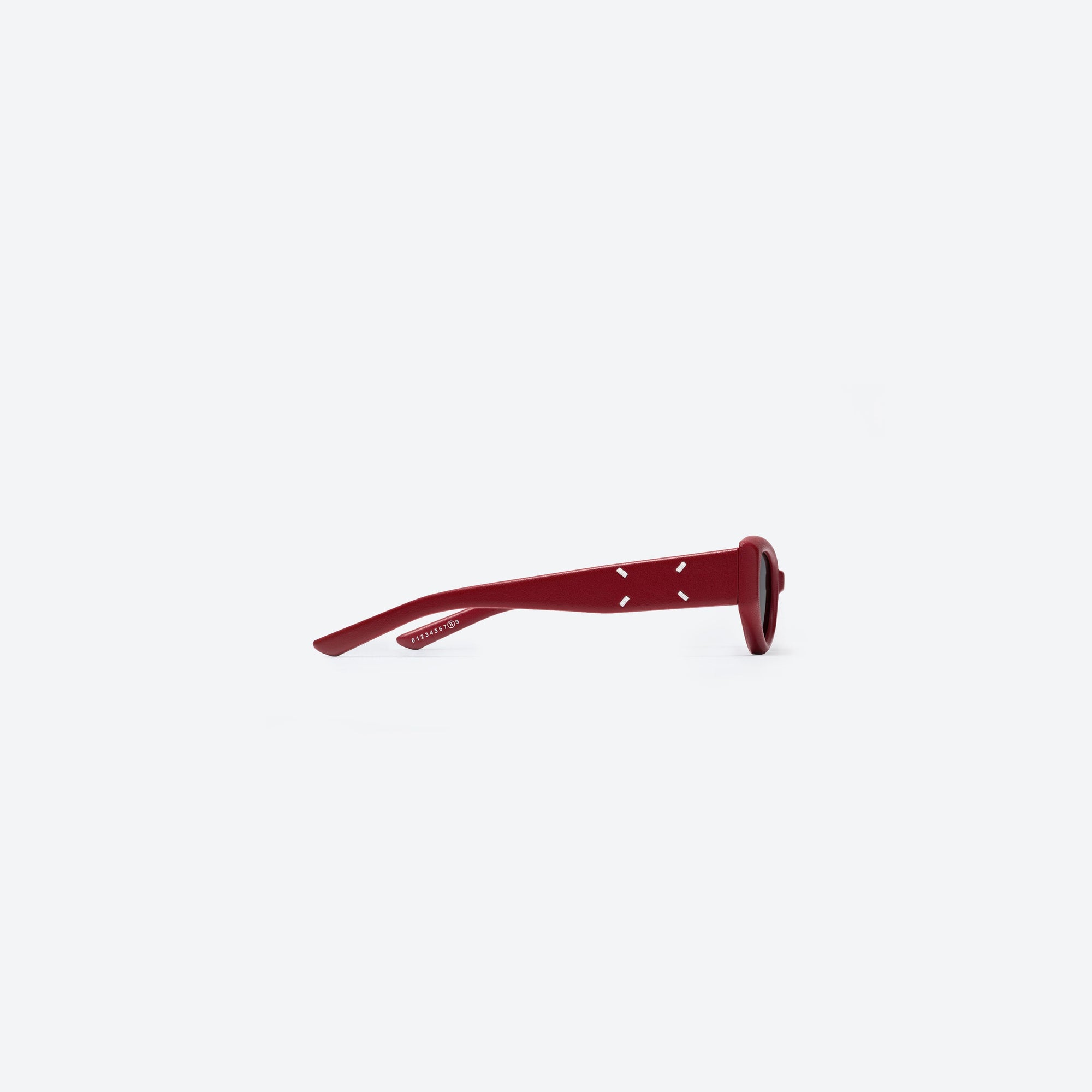 A detailed right view of Gentle Monster Maison Margiela - MM205 Leather LR1 Red Acetate framed Cat-eye sunglasses.