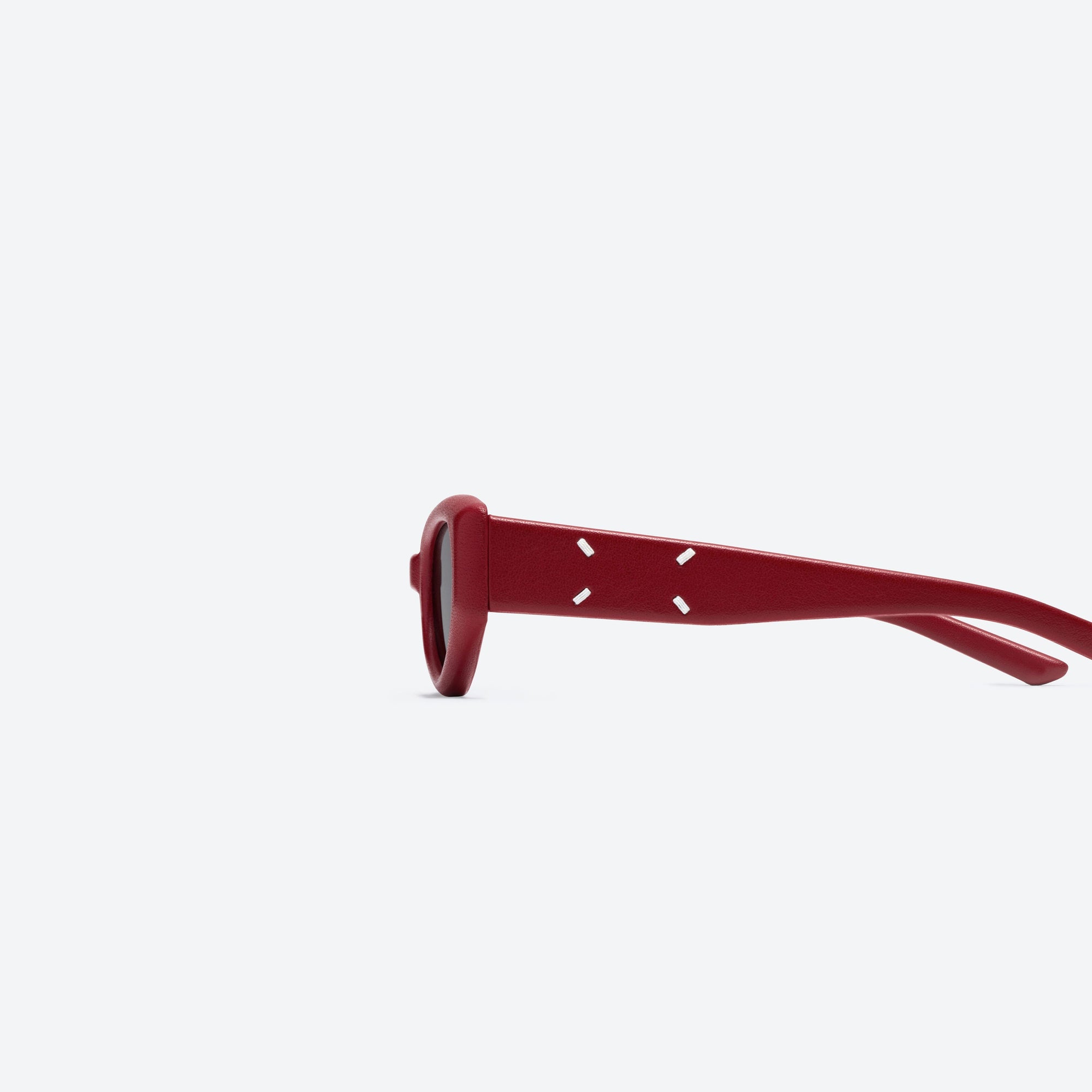 A detailed left view of Gentle Monster Maison Margiela - MM205 Leather LR1 Red Acetate framed Cat-eye sunglasses.