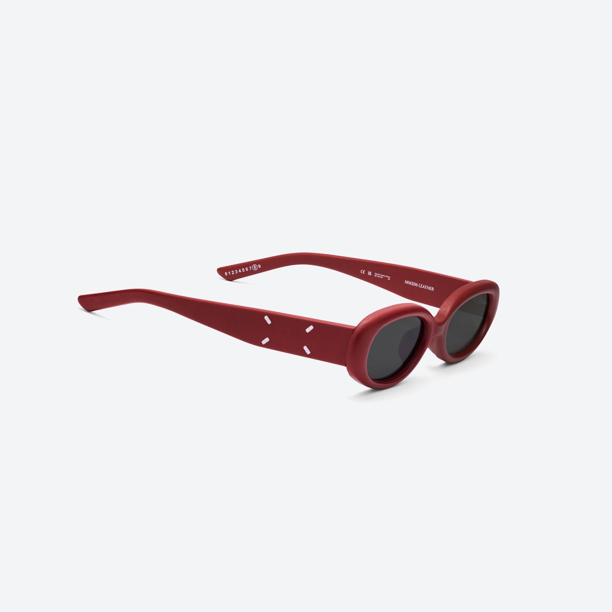45-degree detailed view of Gentle Monster Maison Margiela - MM206 Leather LR1 Red Acetate framed Oval sunglasses.