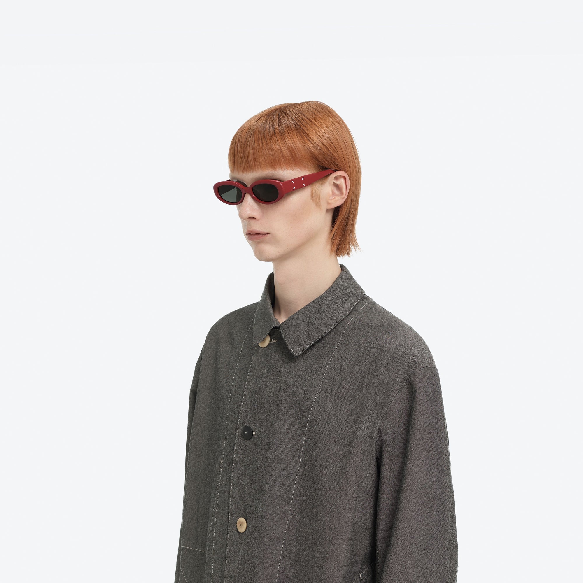 Model wearing the Maison Margiela - MM206 Leather LR1 Red Acetate framed Oval sunglasses.