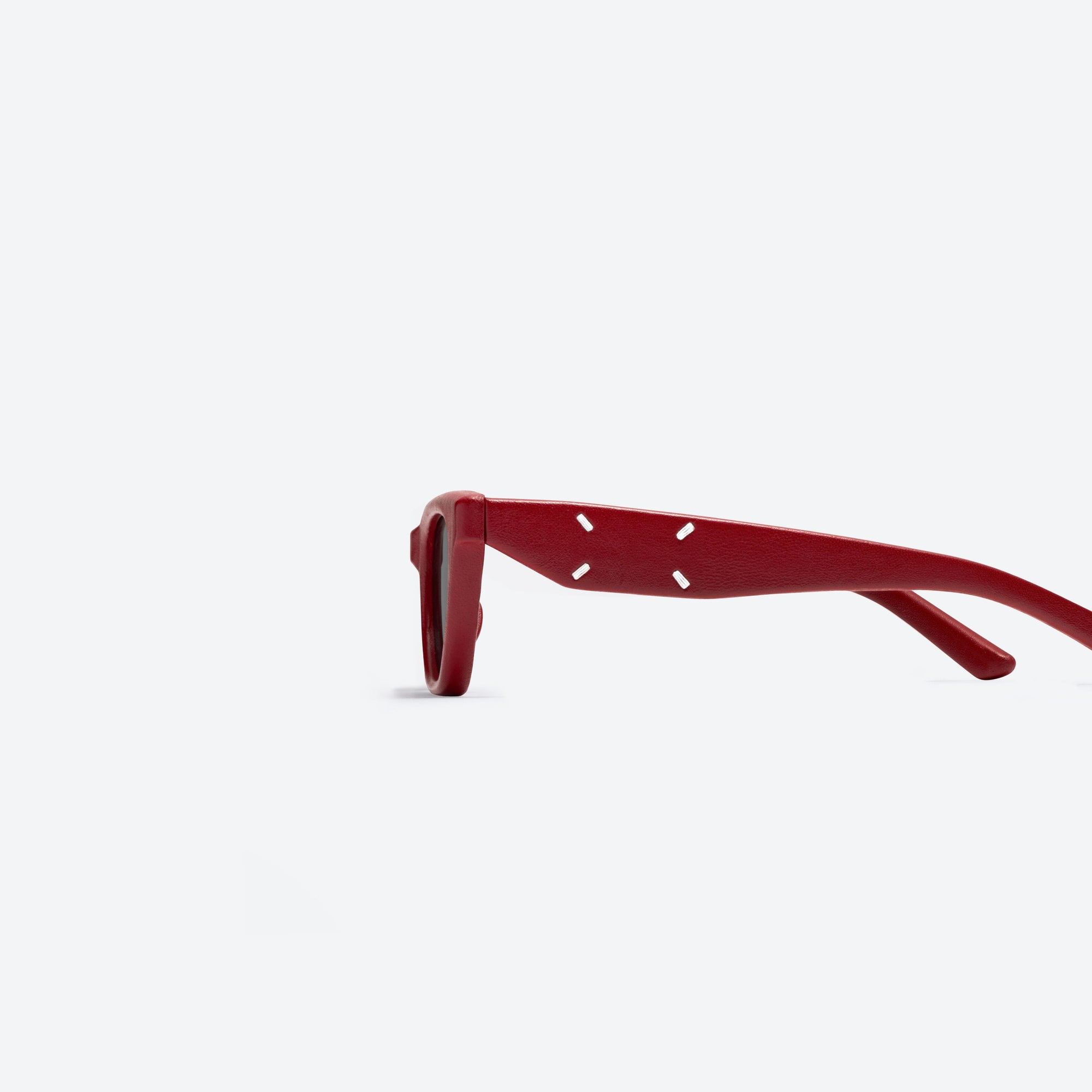 A detailed left view of Gentle Monster Maison Margiela - MM208 Leather LR1 Red Acetate framed Cat-eye sunglasses.