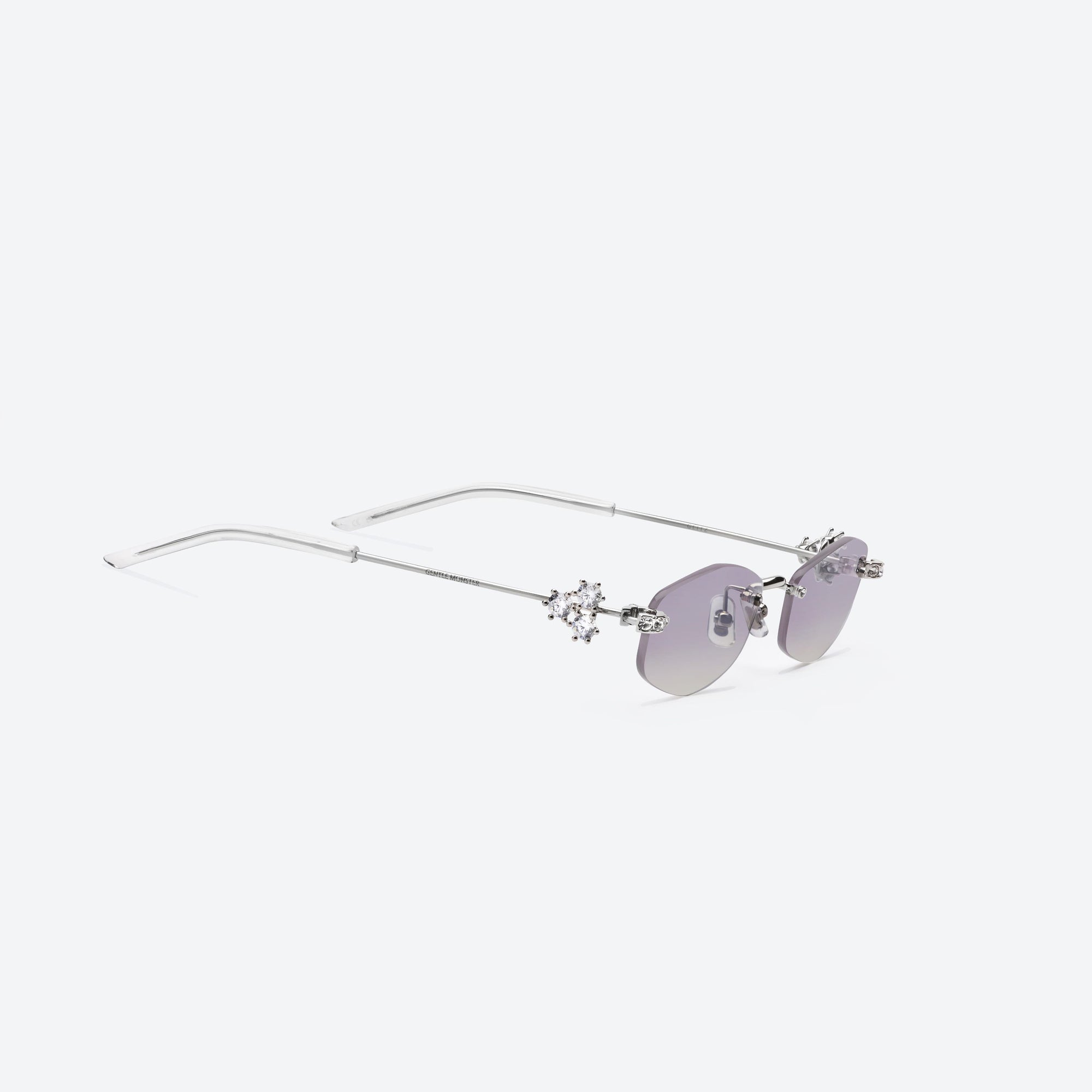 45-degree detailed view of Gentle Monster Glitz 02(VYG) Silver Metal framed Oval sunglasses.