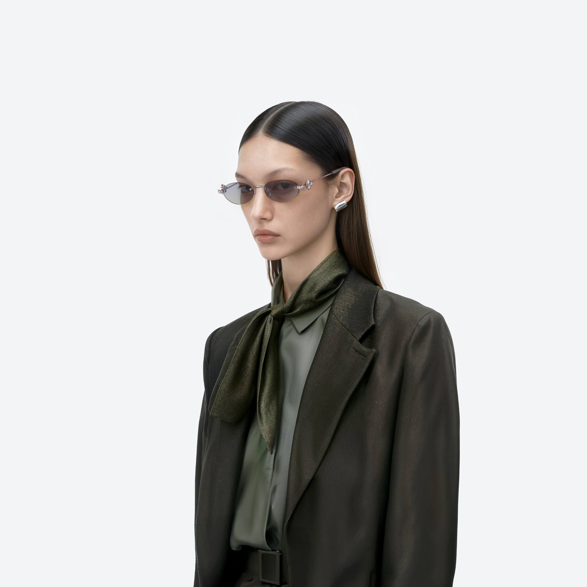Model wearing the Orora 02(VYG) Silver Metal framed Oval sunglasses.