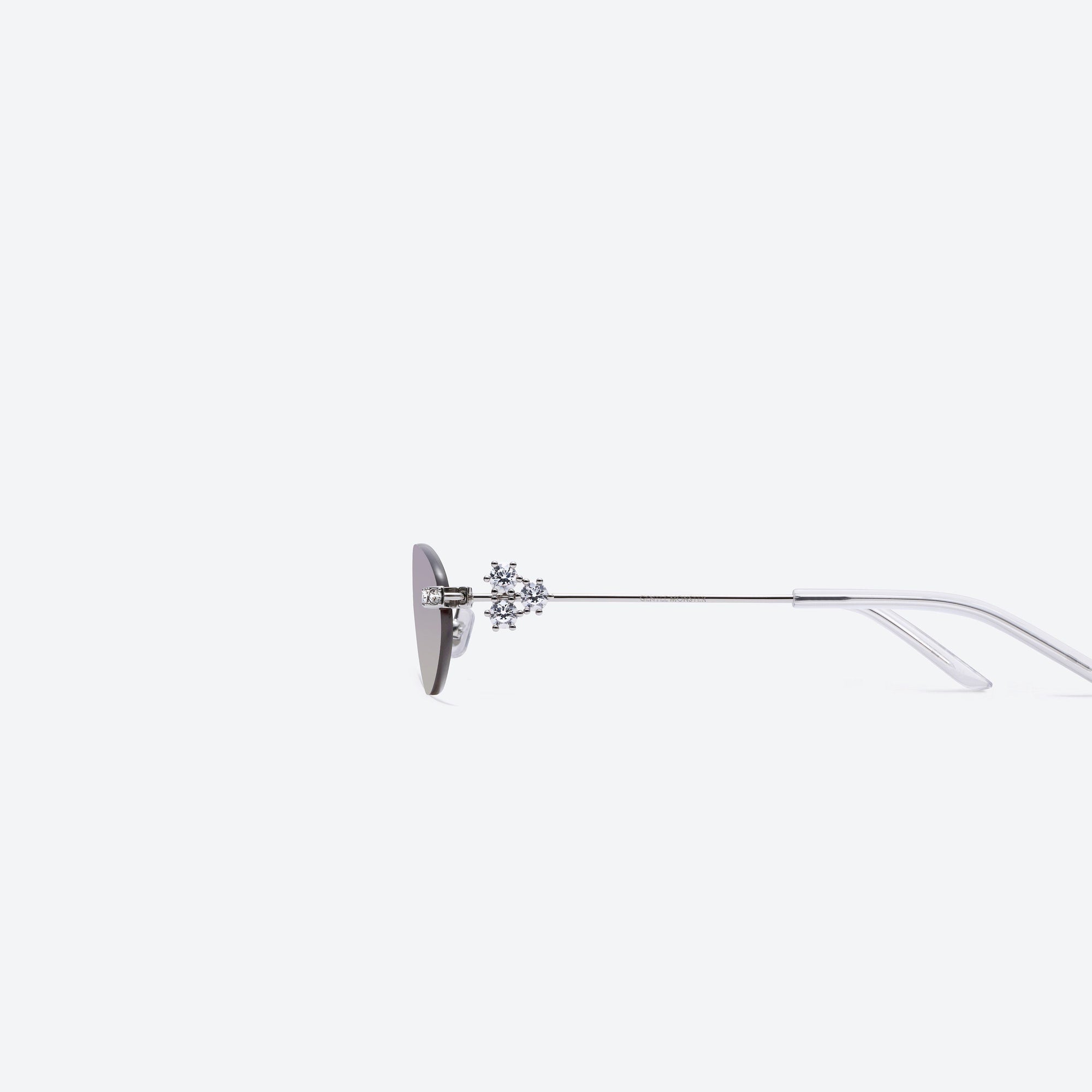A detailed left view of Gentle Monster Orora 02(VYG) Silver Metal framed Oval sunglasses.