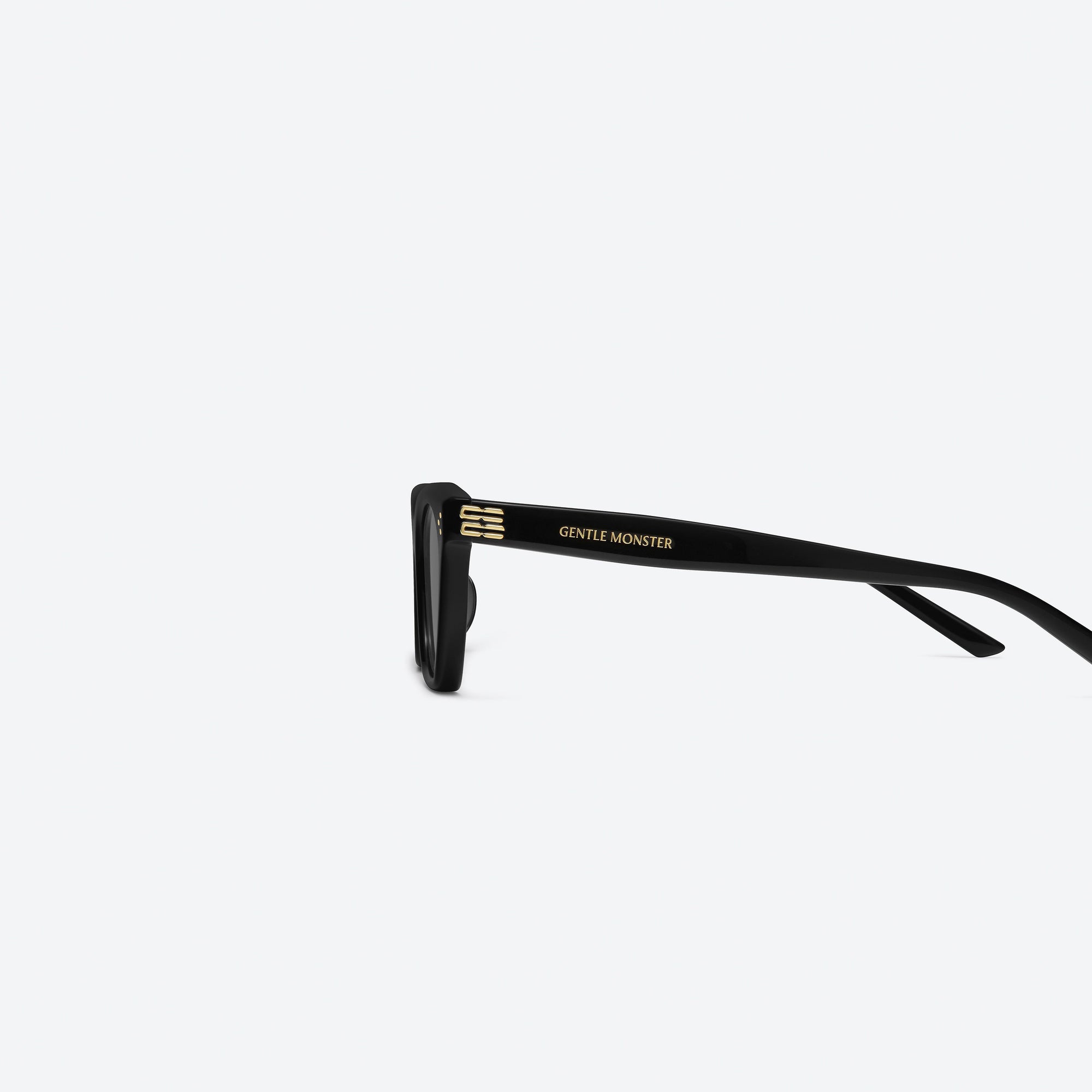 A detailed left view of Gentle Monster Gisele 01 Black Acetate framed Cat-eye sunglasses.