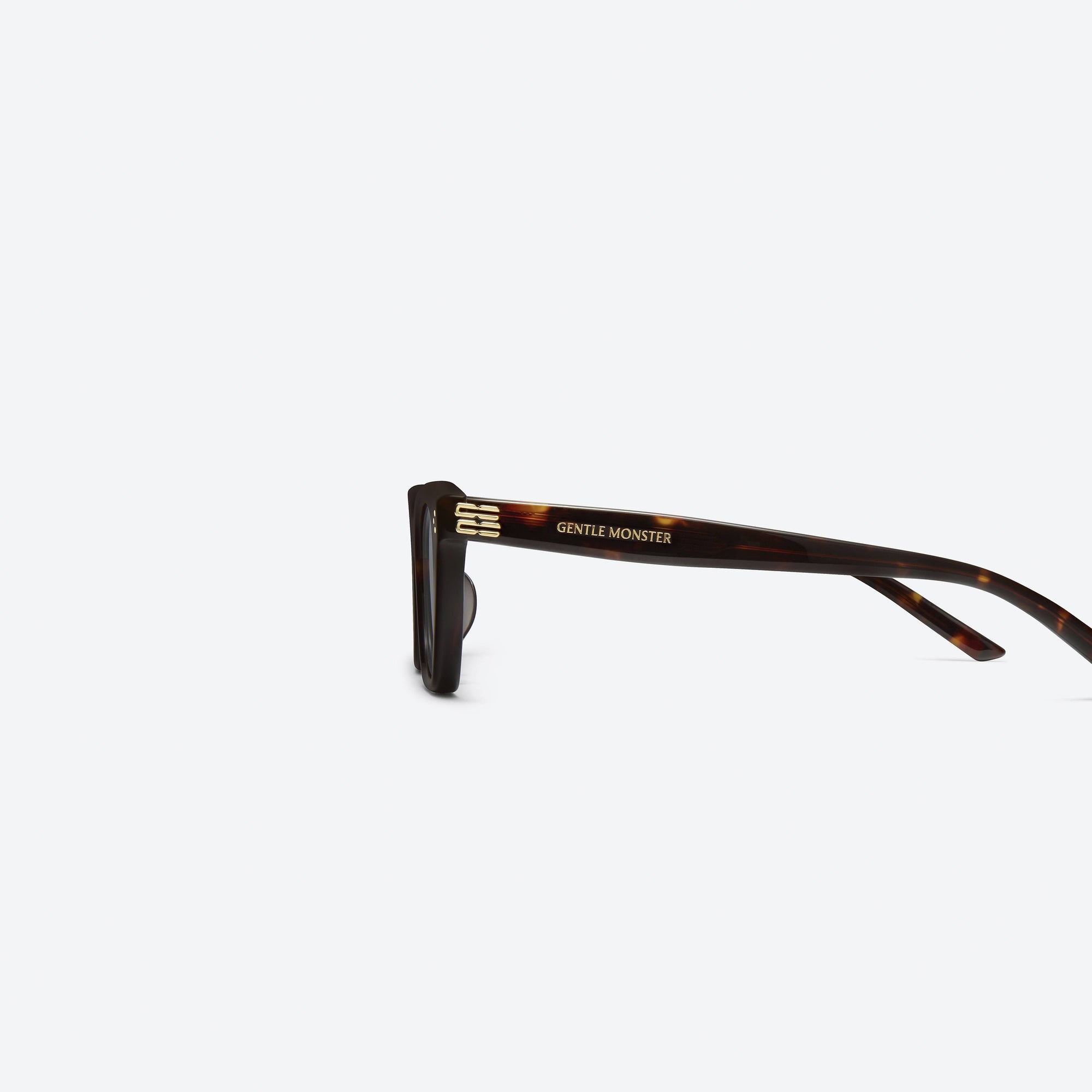 A detailed left view of Gentle Monster Gisele T1 Tortoise Acetate framed Cat-eye sunglasses.