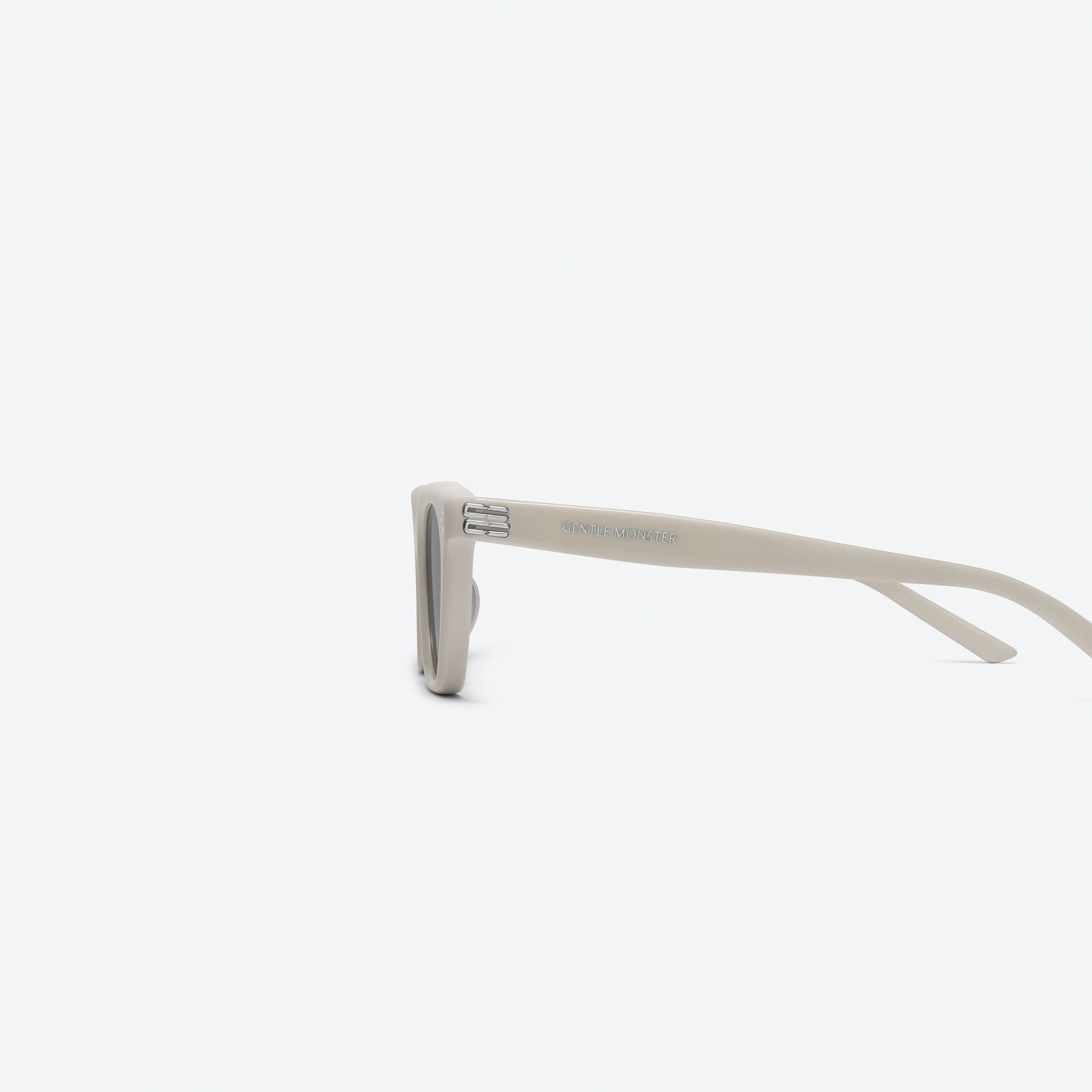 A detailed left view of Gentle Monster Gisele IV3 Ivory Acetate framed Cat-eye sunglasses.