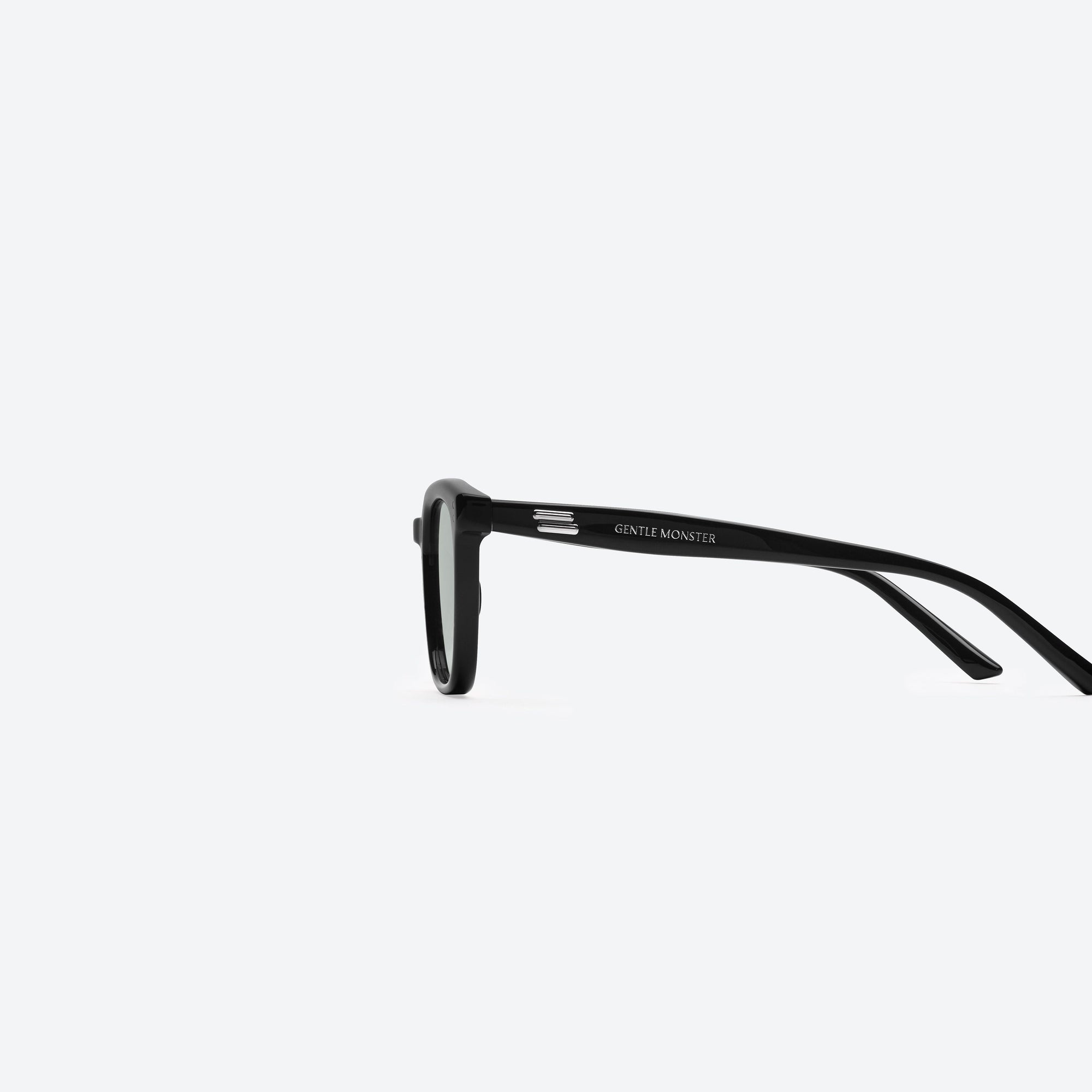 A detailed left view of Gentle Monster Days Day 01(K) Black Acetate framed Square sunglasses.