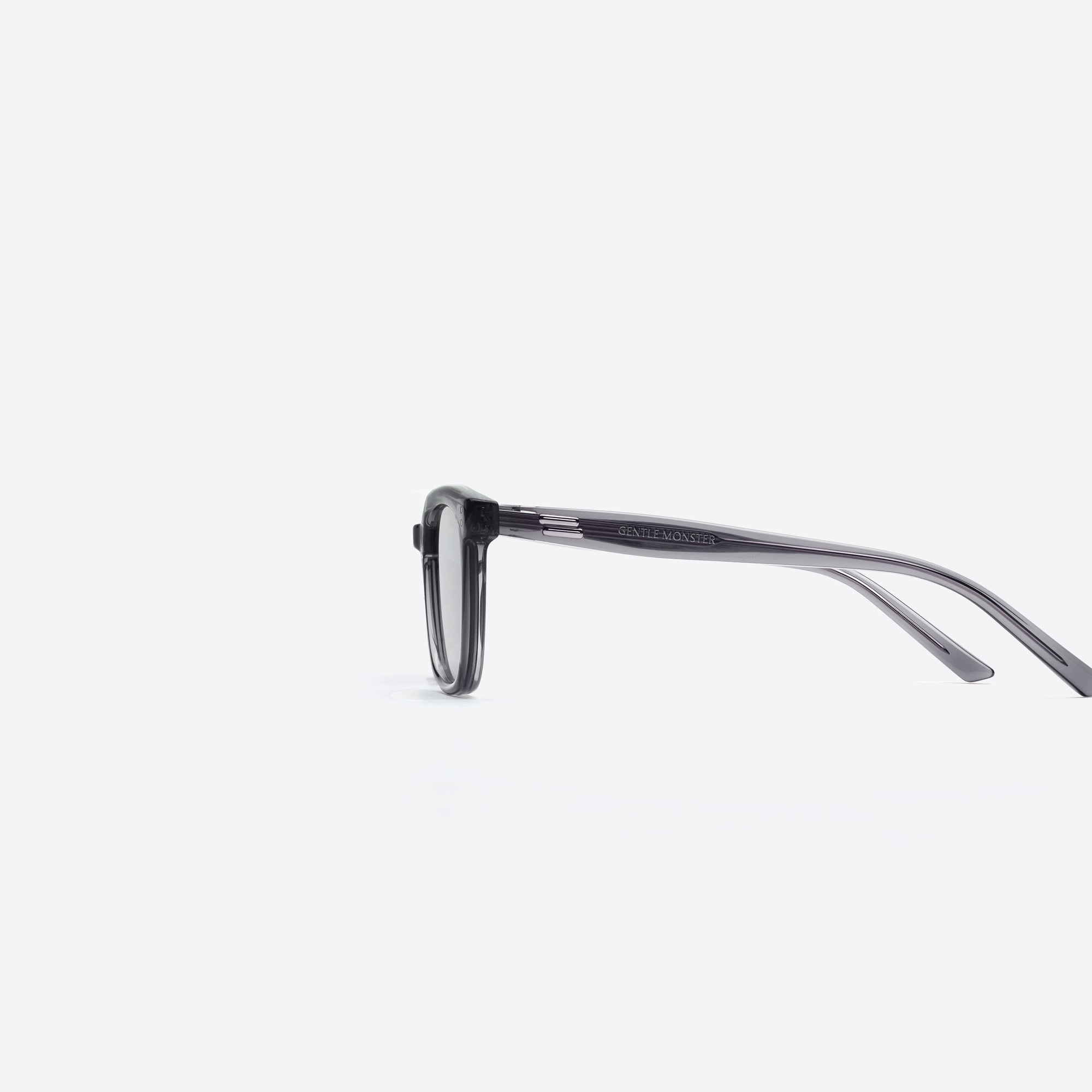 A detailed left view of Gentle Monster Days Day GC12 Gray Acetate framed Square sunglasses.