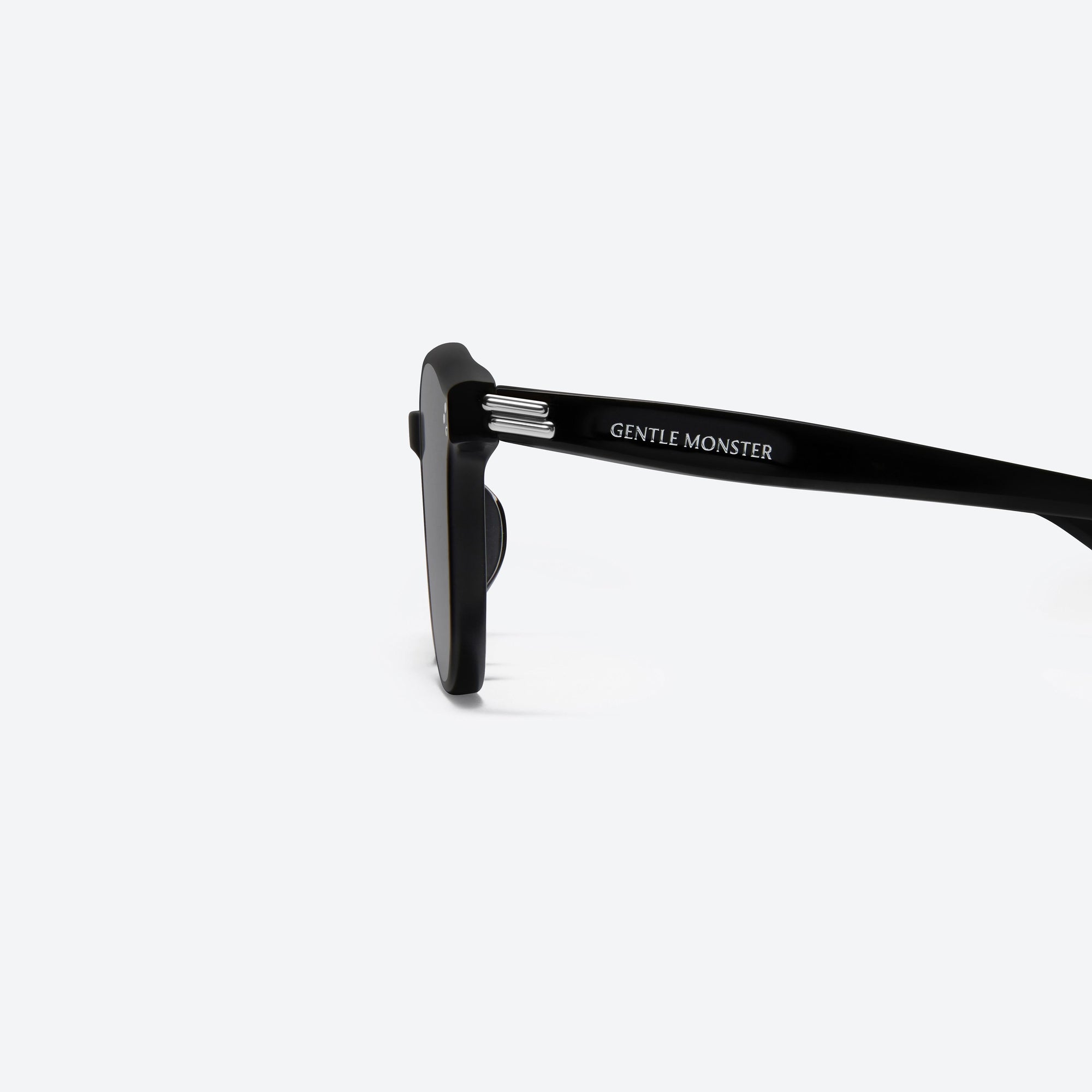 A detailed left view of Gentle Monster Dean 01 Black Acetate framed Round sunglasses.