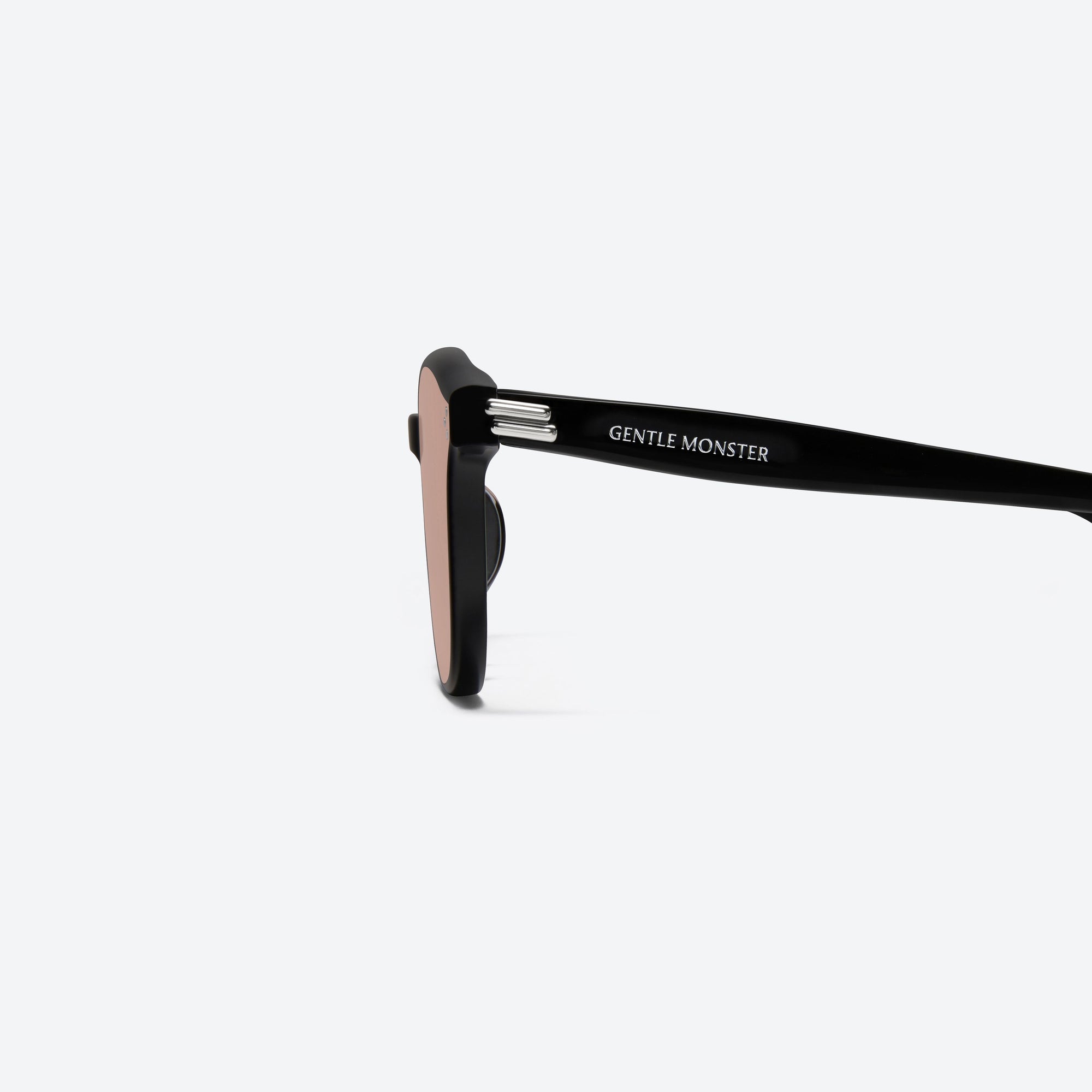 A detailed left view of Gentle Monster Dean 01(OR) Black Acetate framed Round sunglasses.