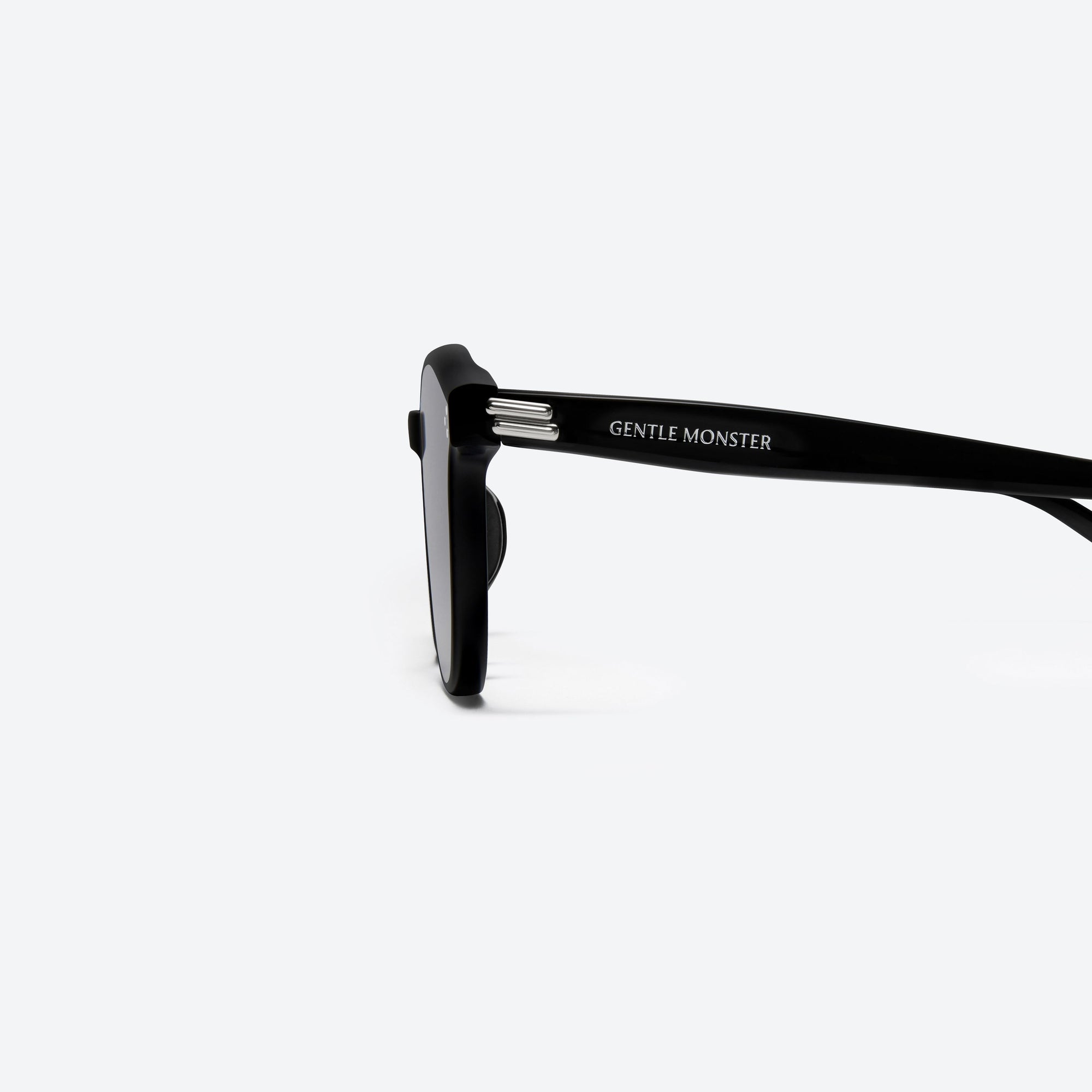 A detailed left view of Gentle Monster Dean 01(G) Black Acetate framed Round sunglasses.
