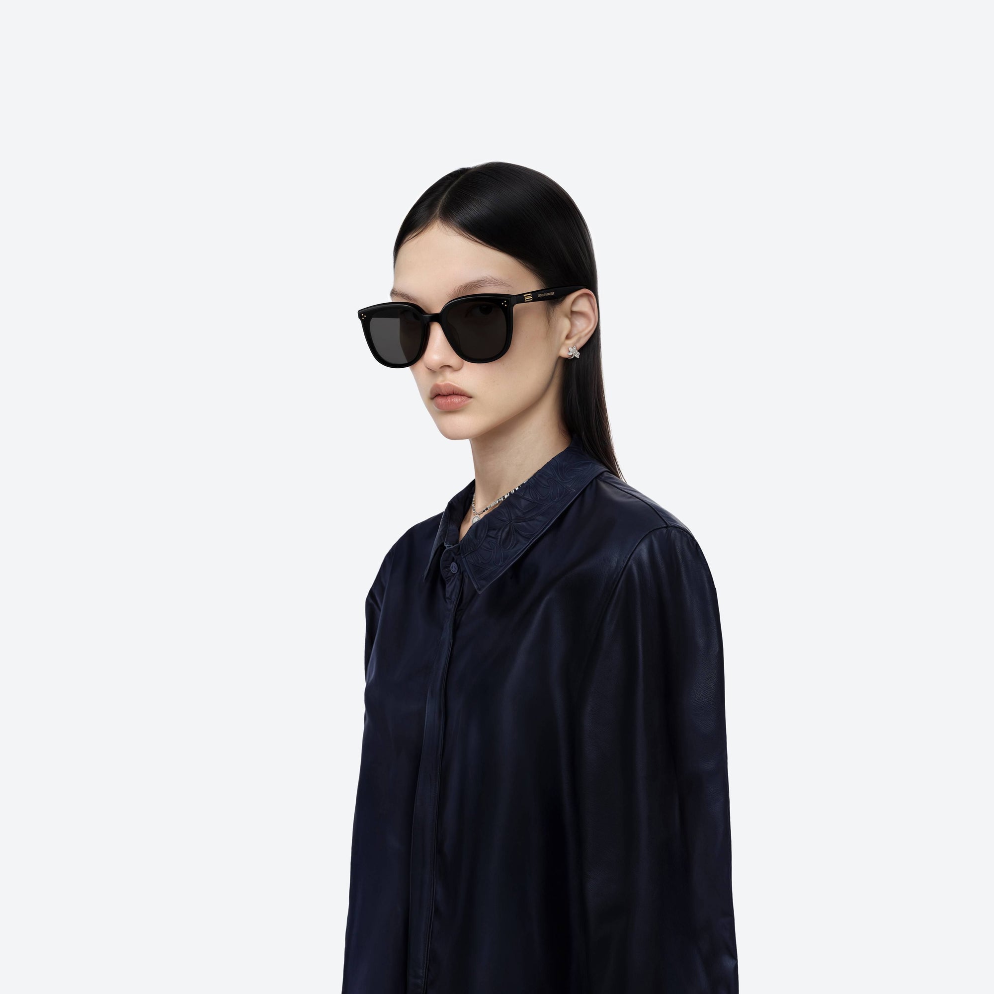 Model wearing the Lady Lang 01 Black Acetate framed Round sunglasses.