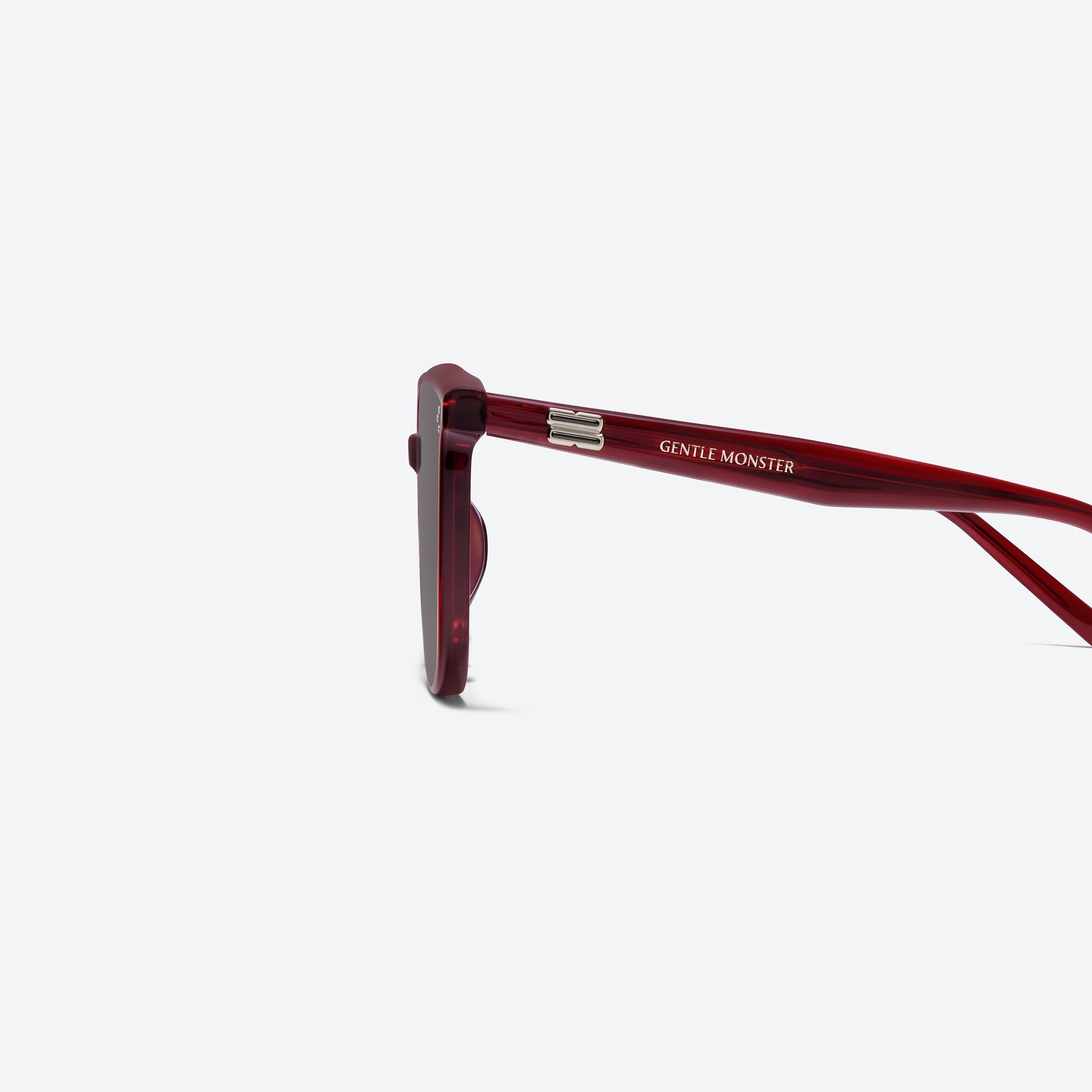 A detailed left view of Gentle Monster Lady Lang RC3 Red Acetate framed Round sunglasses.