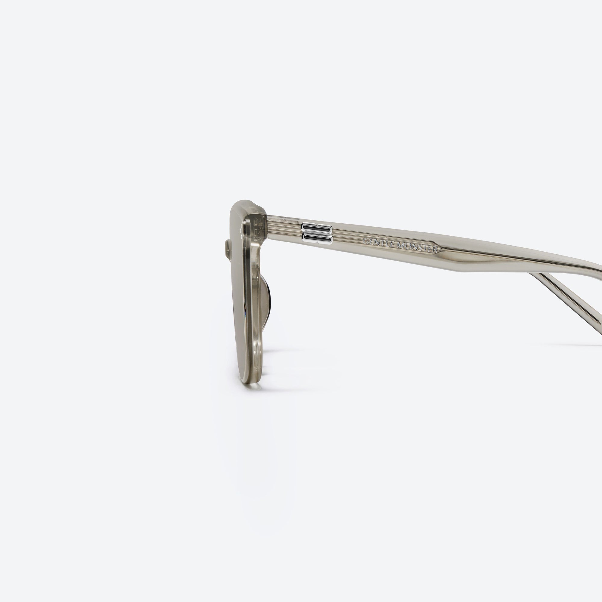 A detailed left view of Gentle Monster Lady Lang BRC11 Brown Acetate framed Round sunglasses.