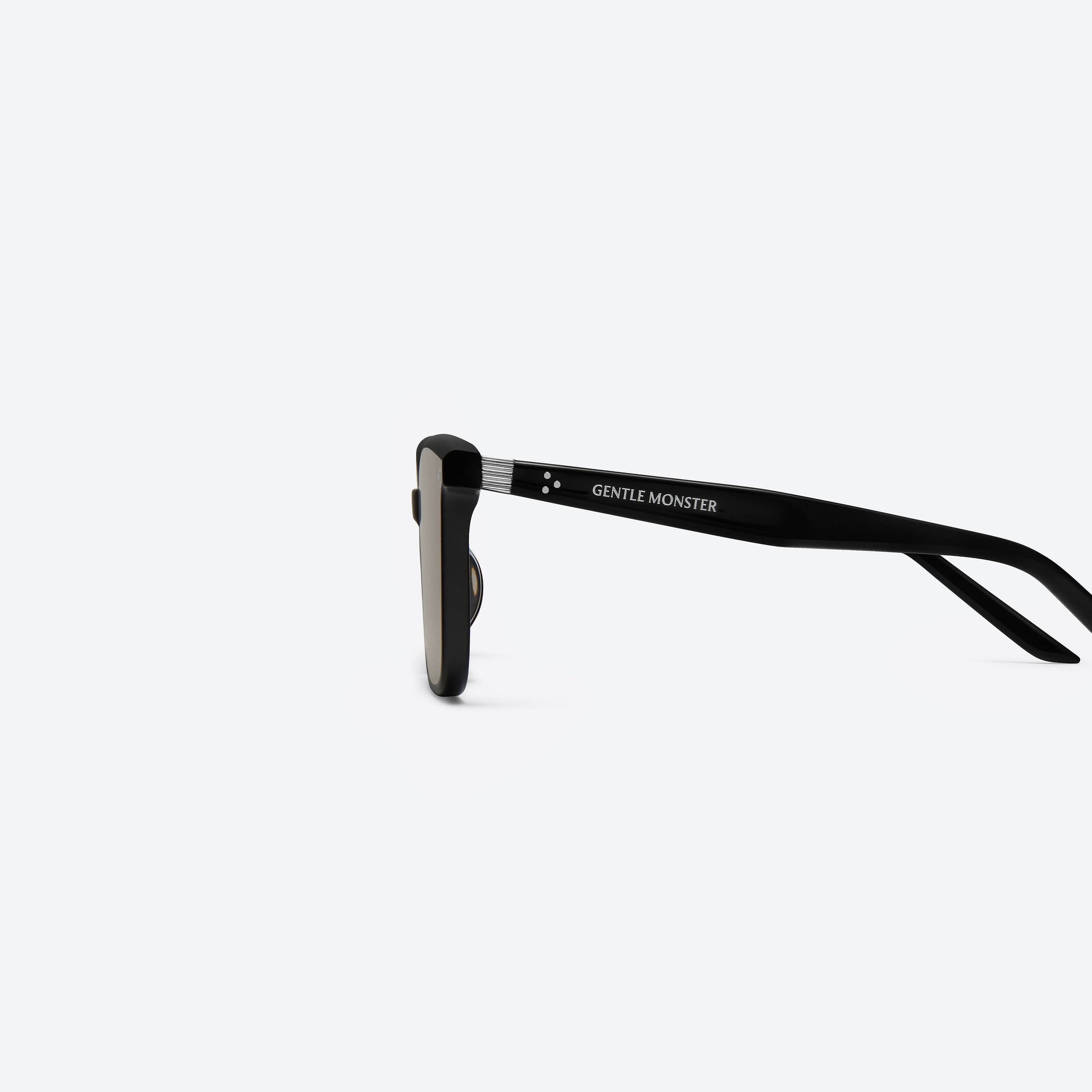 A detailed left view of Gentle Monster By Row 01(BR) Black Acetate framed Square sunglasses.