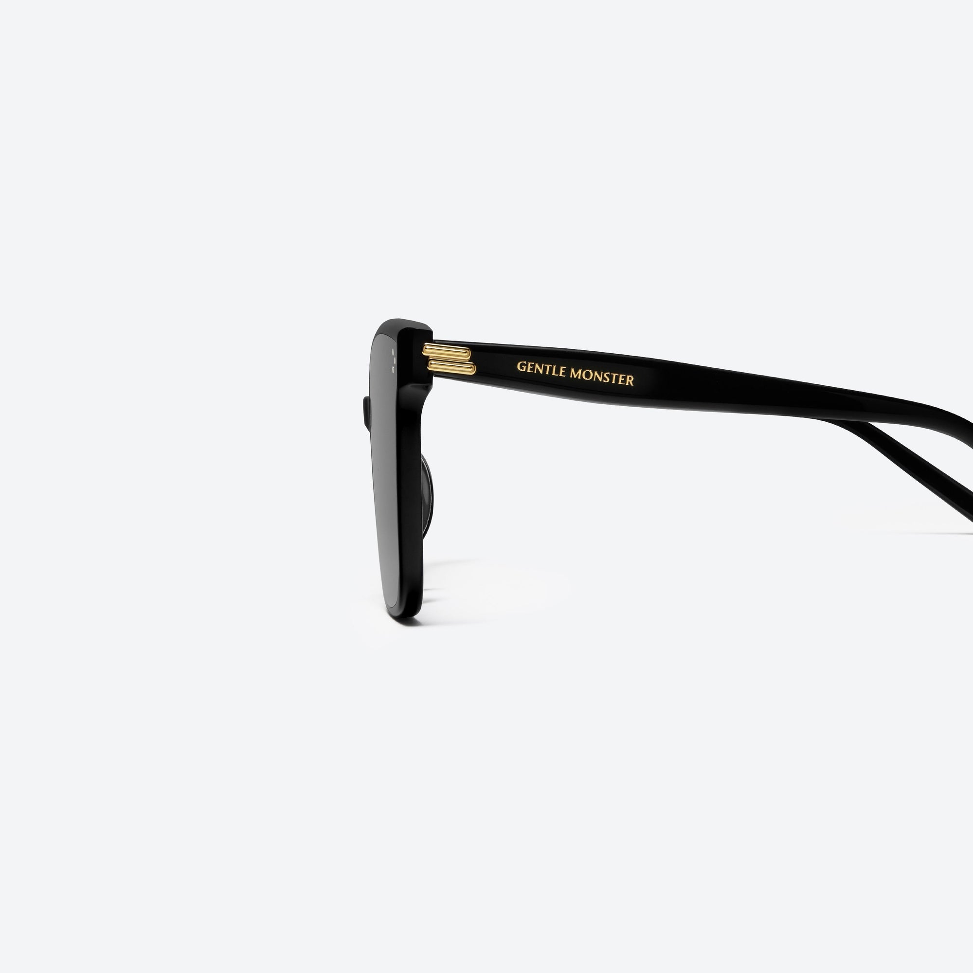 A detailed left view of Gentle Monster New Her 01 Black Acetate framed Square sunglasses.