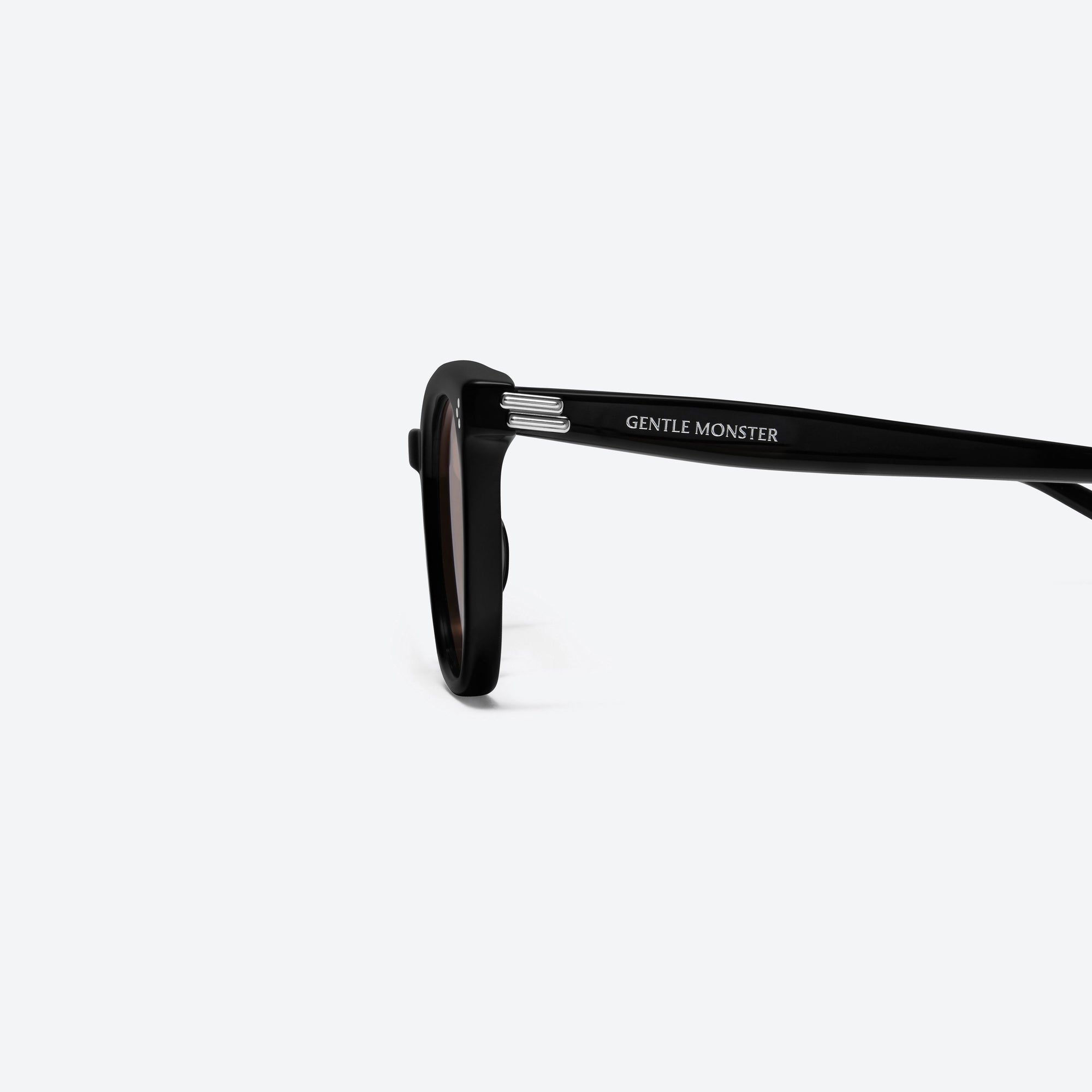 A detailed left view of Gentle Monster Bloomo 01(OR) Black Acetate framed Square sunglasses.