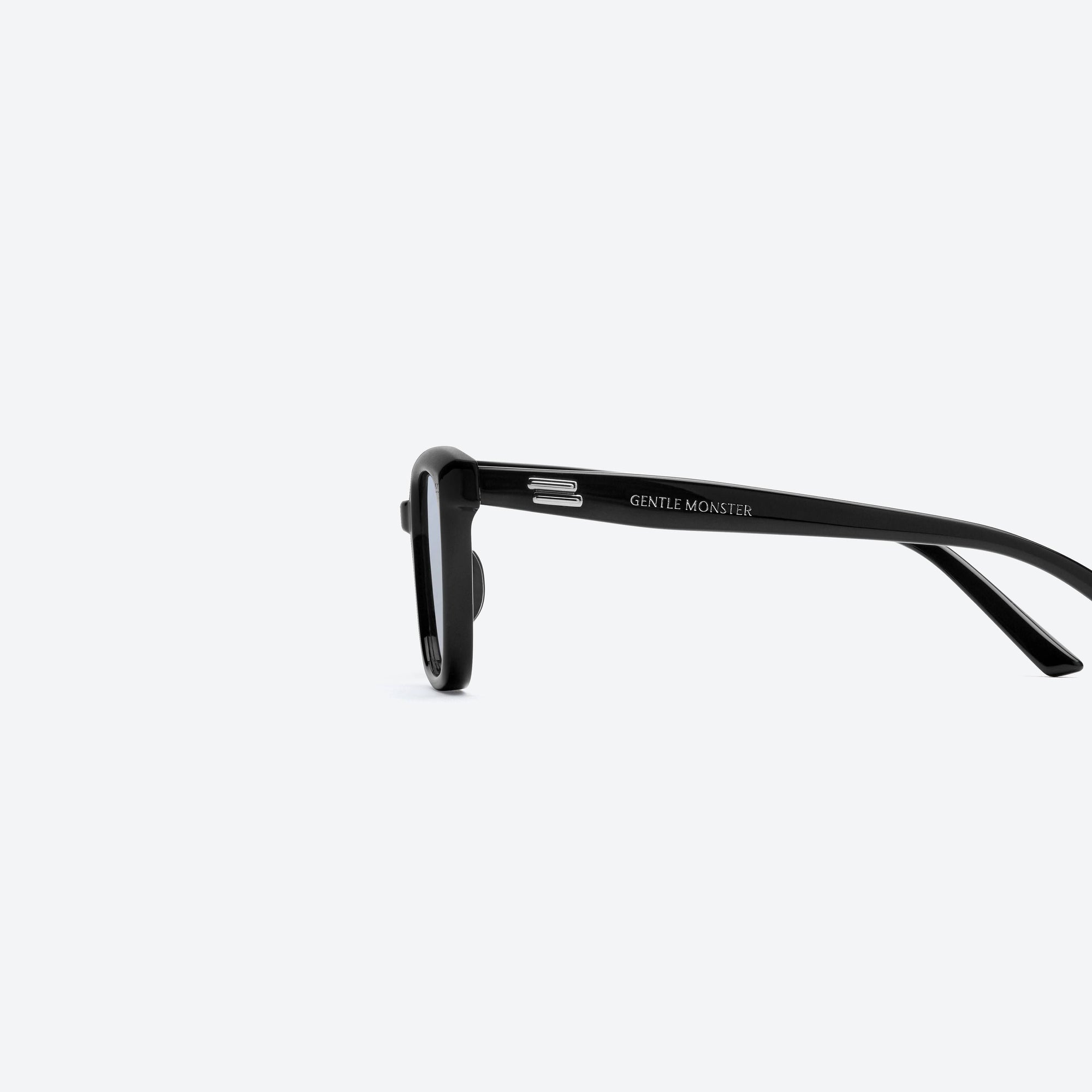 A detailed left view of Gentle Monster Breezebe 01(BL) Black Acetate framed Square sunglasses.