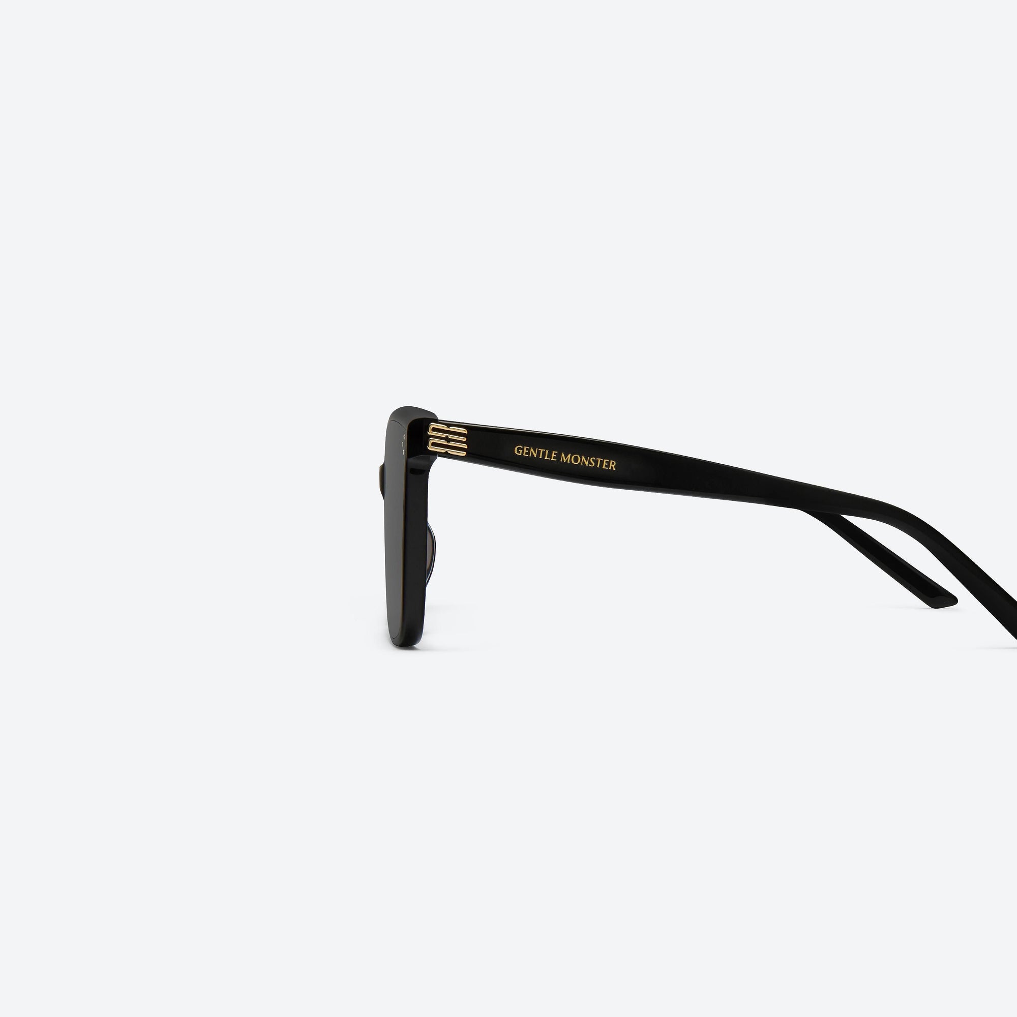 A detailed left view of Gentle Monster Piana 01 Black Acetate framed Square sunglasses.