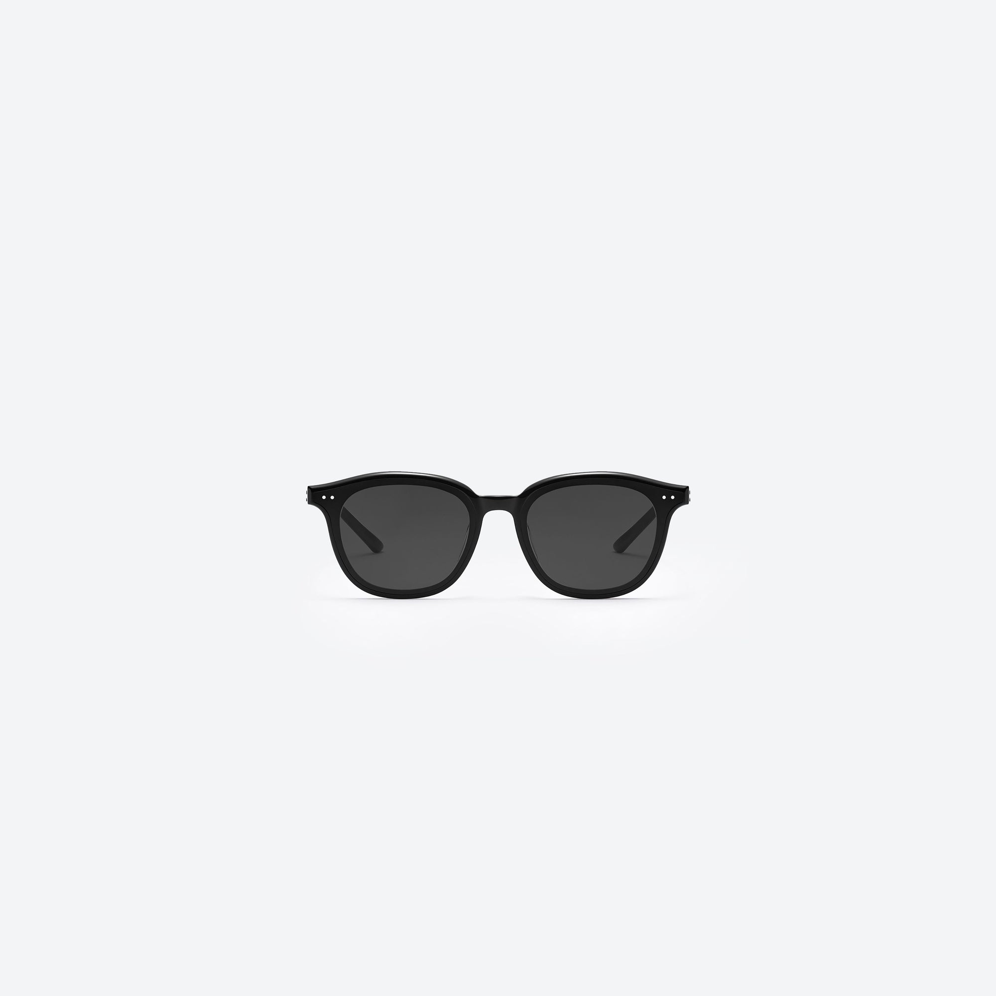 A front view of Gentle Monster Jude 01 Black Acetate framed Round sunglasses.