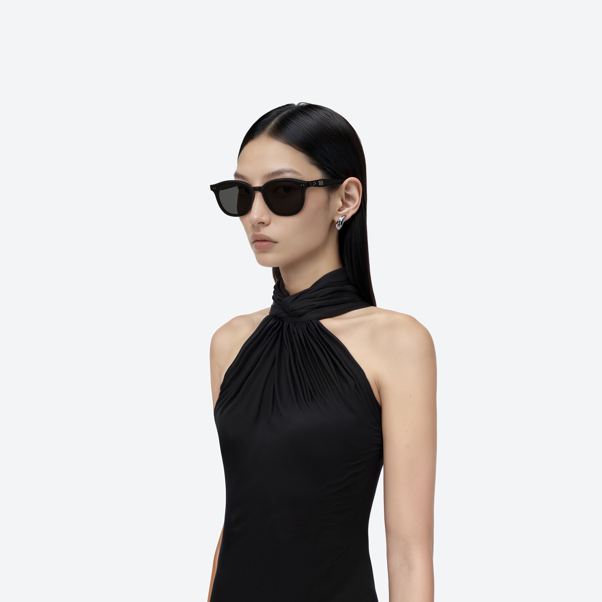 Model wearing the Jude 01 Black Acetate framed Round sunglasses.